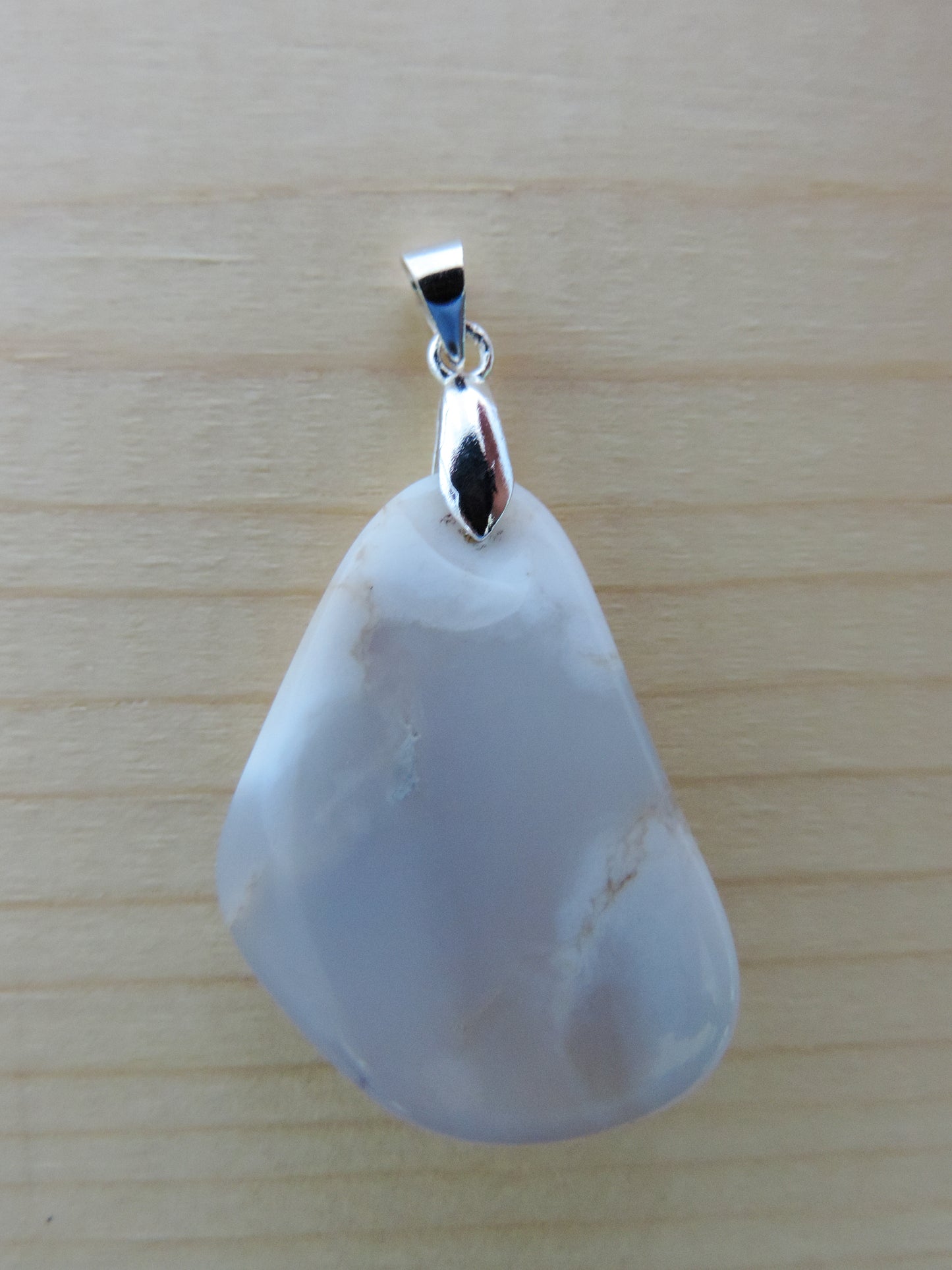 This rare stone is found in only a few locations in Montana, our material is hand collected on private property in the mountains and carried out in backpacks...each piece worth its weight in every step!  The translucent blue agate and its color variations have an alluring effect, many people find the blue agate a relaxing, calming and peaceful stone to wear.  Original and unique in design, each piece is hand crafted by lapidary artists in Montana.