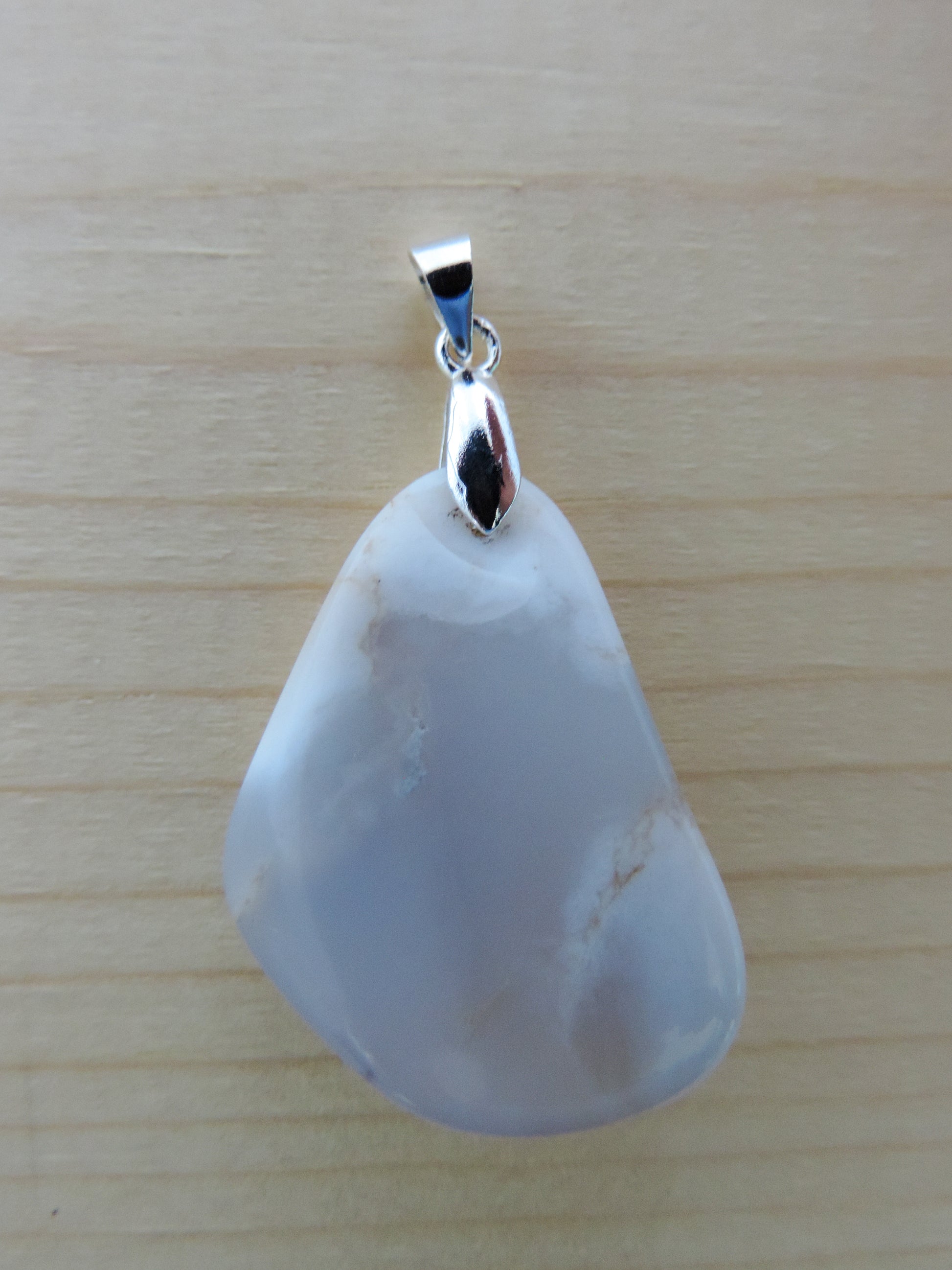 This rare stone is found in only a few locations in Montana, our material is hand collected on private property in the mountains and carried out in backpacks...each piece worth its weight in every step!  The translucent blue agate and its color variations have an alluring effect, many people find the blue agate a relaxing, calming and peaceful stone to wear.  Original and unique in design, each piece is hand crafted by lapidary artists in Montana.