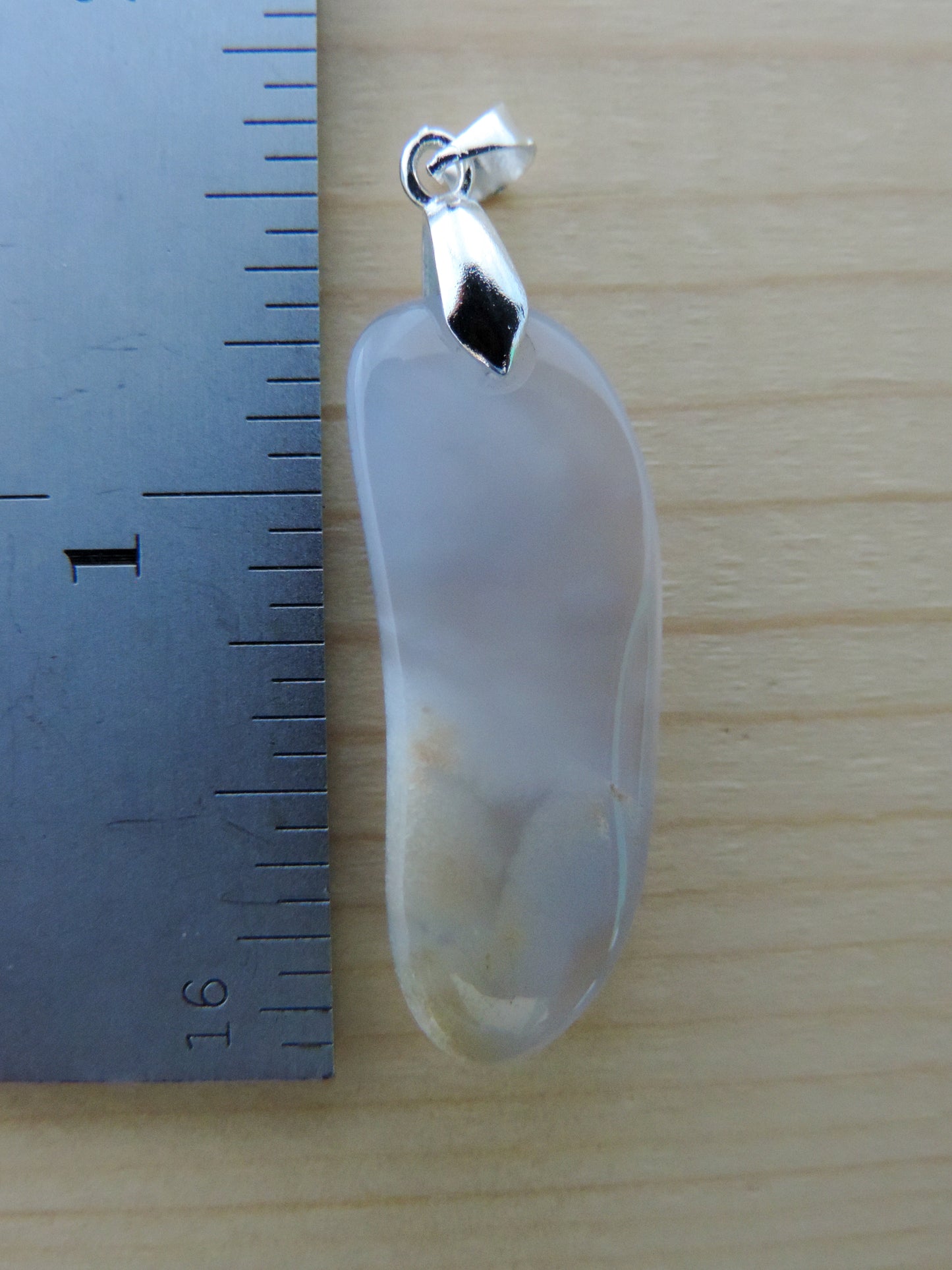 This rare stone is found in only a few locations in Montana, our material is hand collected on private property in the mountains and carried out in backpacks...each piece worth its weight in every step!  The translucent blue agate and its color variations have an alluring effect, many people find the blue agate a relaxing, calming and peaceful stone to wear.  Original and unique in design, each piece is hand crafted by lapidary artists in Montana.