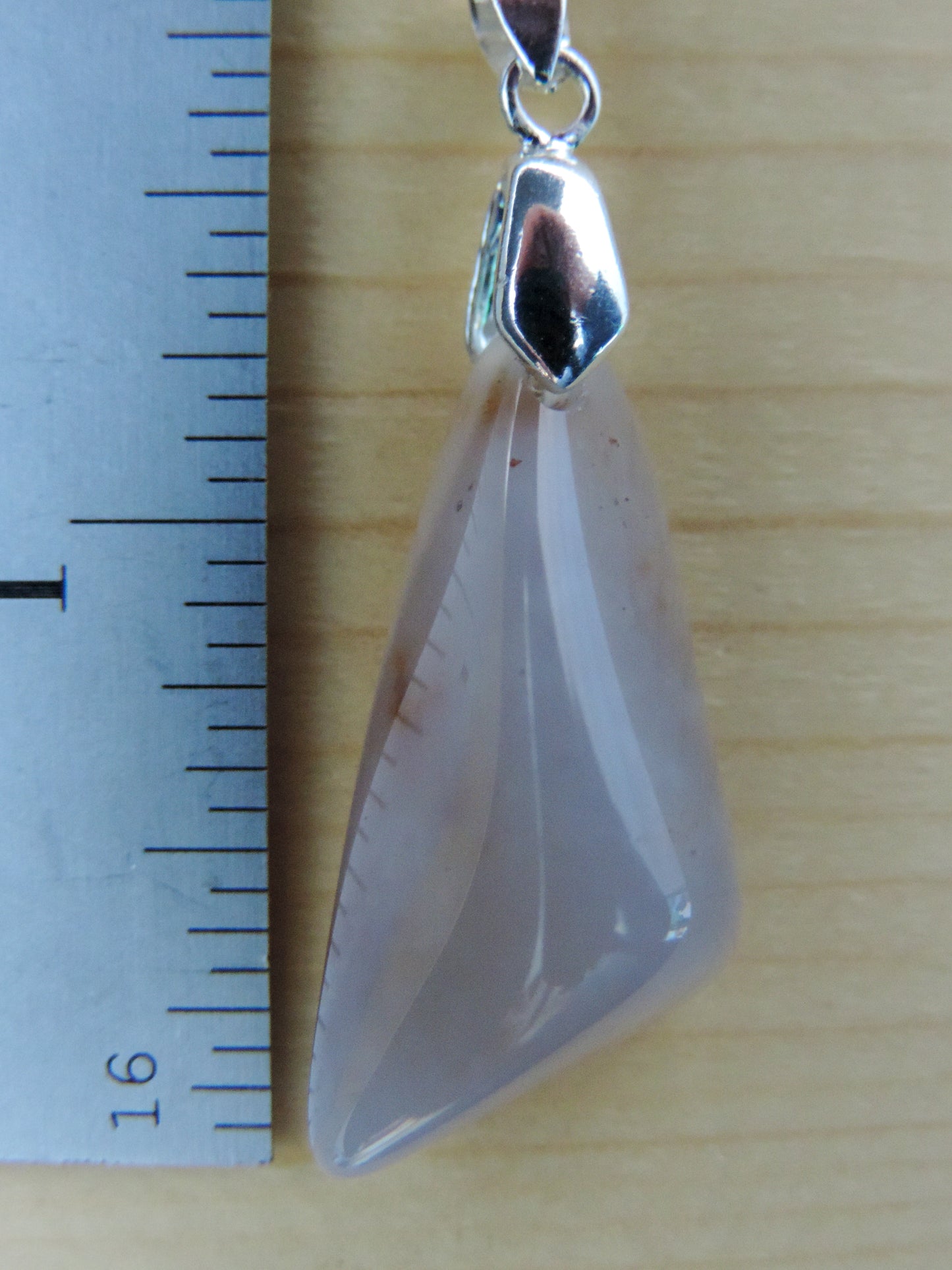 This rare stone is found in only a few locations in Montana, our material is hand collected on private property in the mountains and carried out in backpacks...each piece worth its weight in every step!  The translucent blue agate and its color variations have an alluring effect, many people find the blue agate a relaxing, calming and peaceful stone to wear.  Original and unique in design, each piece is hand crafted by lapidary artists in Montana.