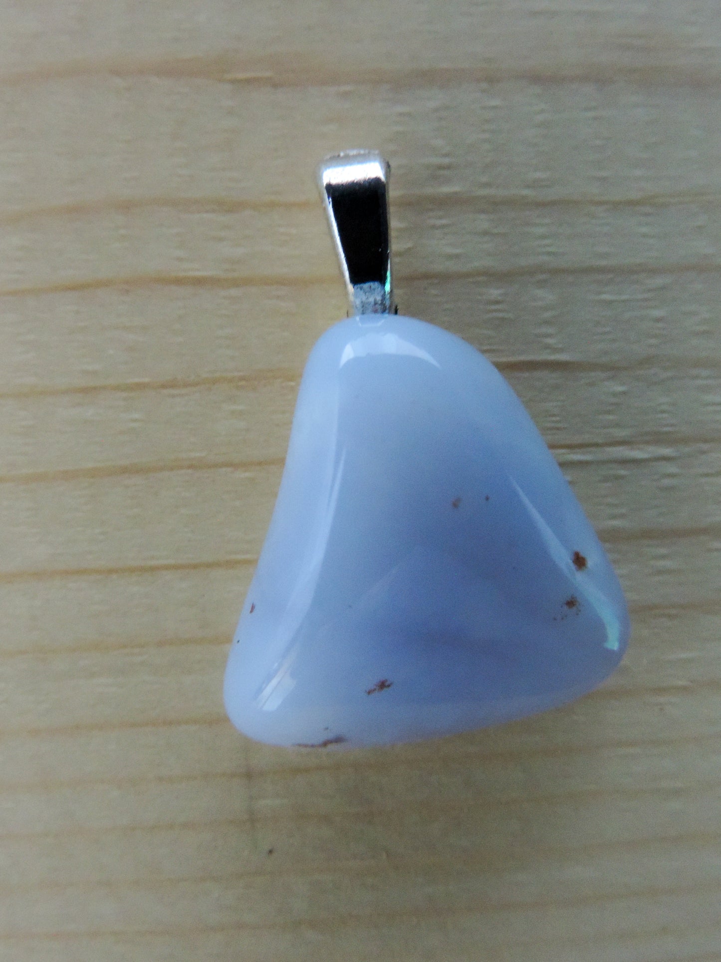 This rare stone is found in only a few locations in Montana, our material is hand collected on private property in the mountains and carried out in backpacks...each piece worth its weight in every step!  The translucent blue agate and its color variations have an alluring effect, many people find the blue agate a relaxing, calming and peaceful stone to wear.  Original and unique in design, each piece is hand crafted by lapidary artists in Montana.