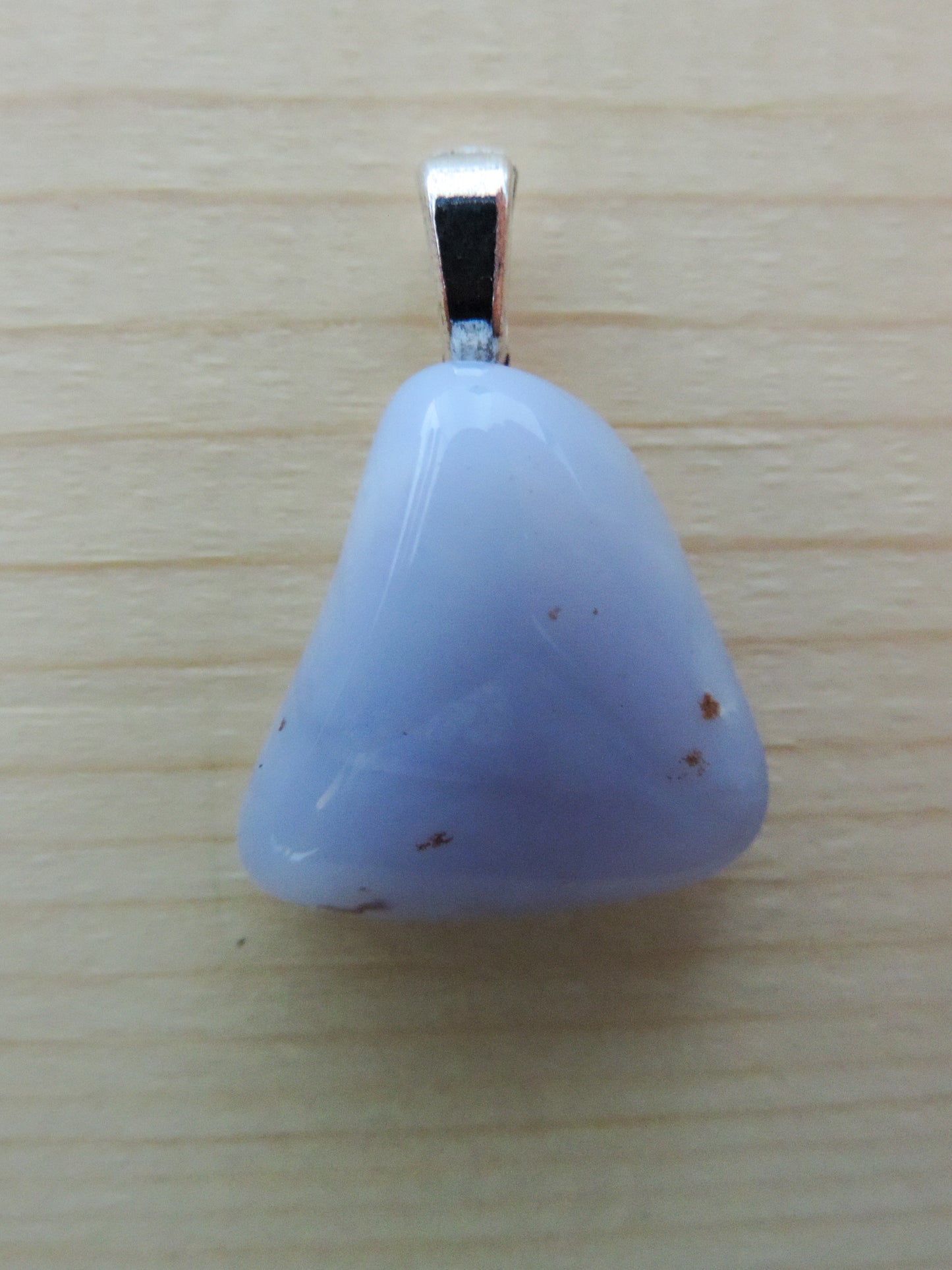 This rare stone is found in only a few locations in Montana, our material is hand collected on private property in the mountains and carried out in backpacks...each piece worth its weight in every step!  The translucent blue agate and its color variations have an alluring effect, many people find the blue agate a relaxing, calming and peaceful stone to wear.  Original and unique in design, each piece is hand crafted by lapidary artists in Montana.