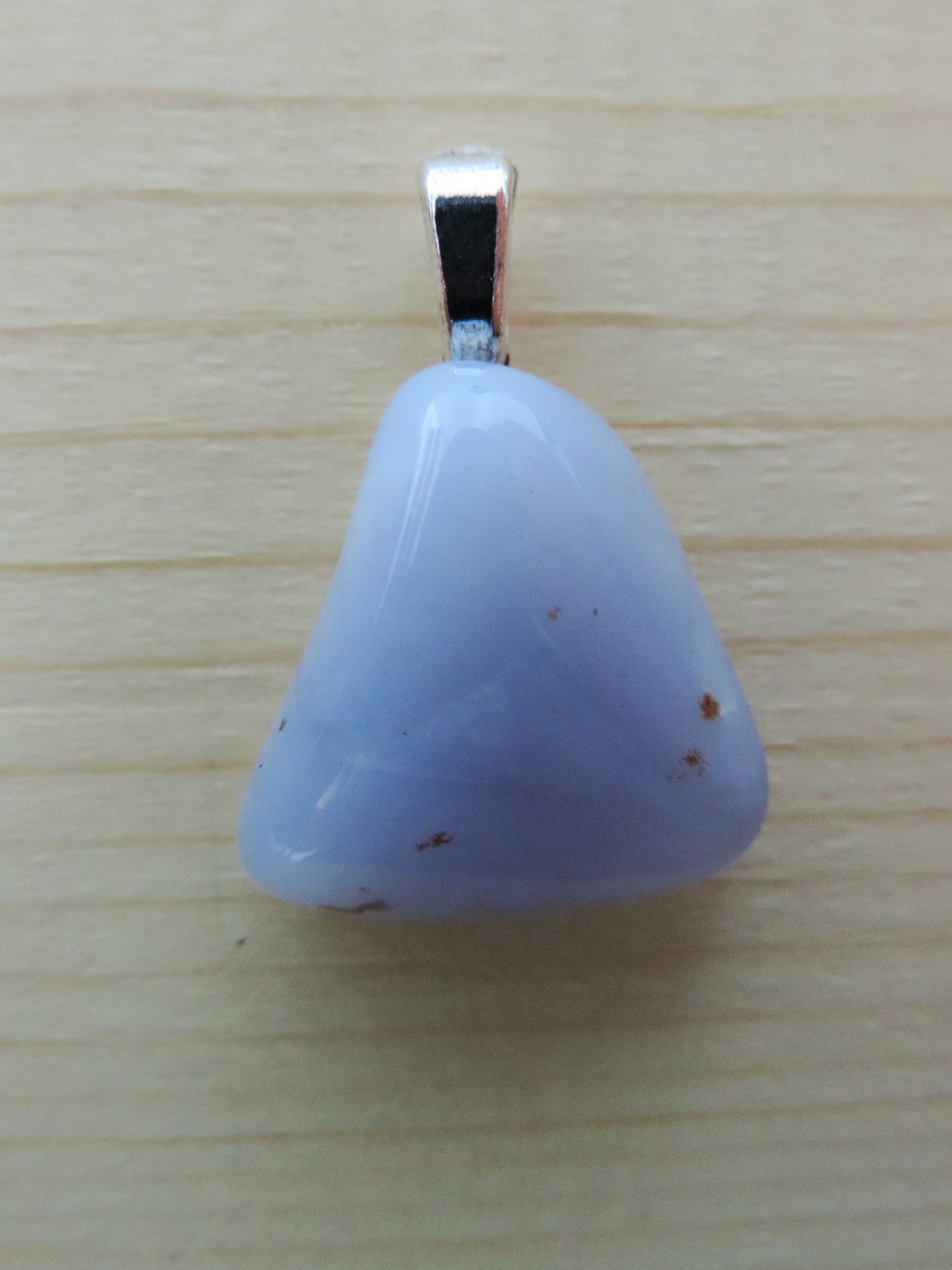 This rare stone is found in only a few locations in Montana, our material is hand collected on private property in the mountains and carried out in backpacks...each piece worth its weight in every step!  The translucent blue agate and its color variations have an alluring effect, many people find the blue agate a relaxing, calming and peaceful stone to wear.  Original and unique in design, each piece is hand crafted by lapidary artists in Montana.