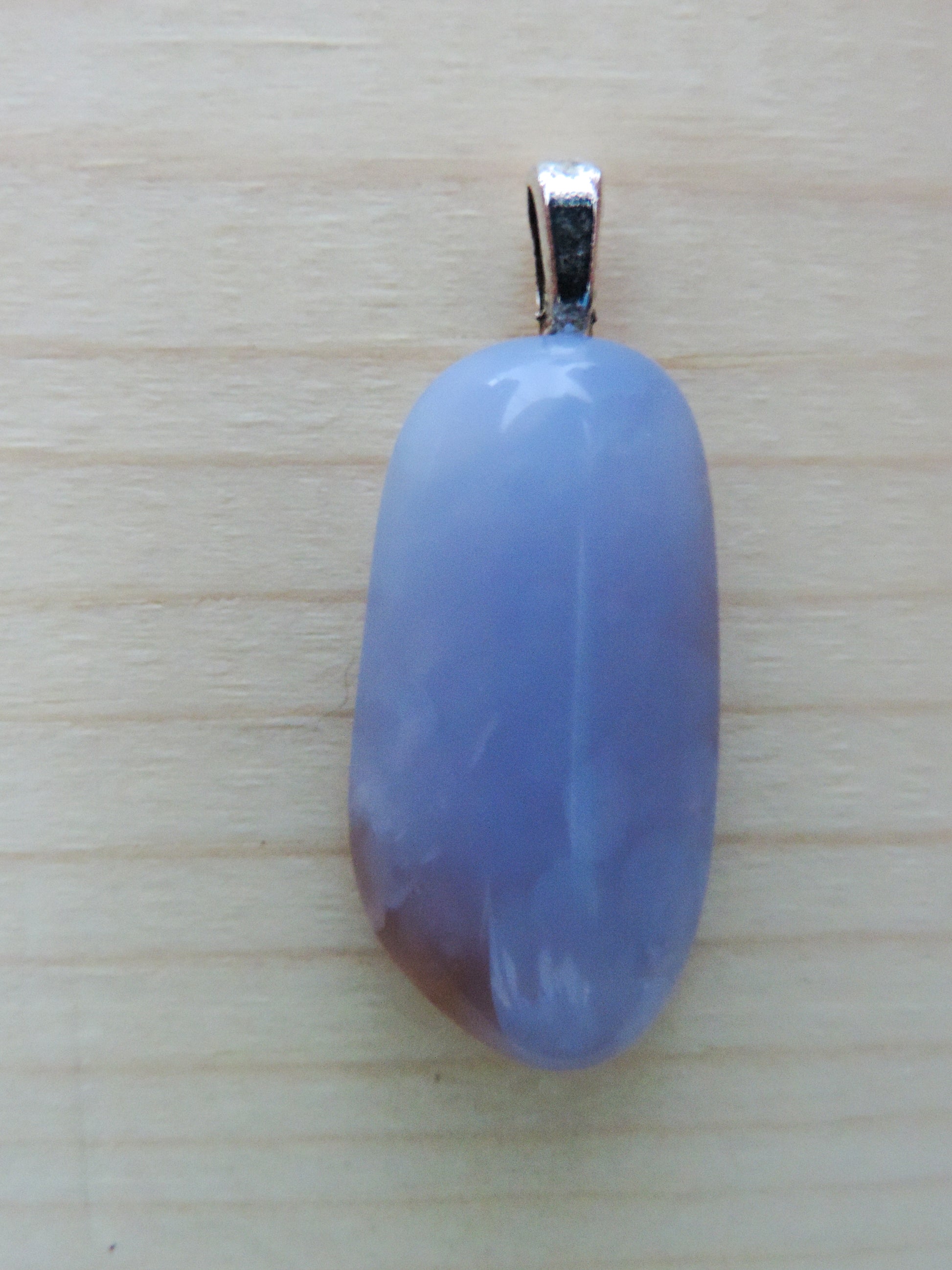 This rare stone is found in only a few locations in Montana, our material is hand collected on private property in the mountains and carried out in backpacks...each piece worth its weight in every step!  The translucent blue agate and its color variations have an alluring effect, many people find the blue agate a relaxing, calming and peaceful stone to wear.  Original and unique in design, each piece is hand crafted by lapidary artists in Montana.