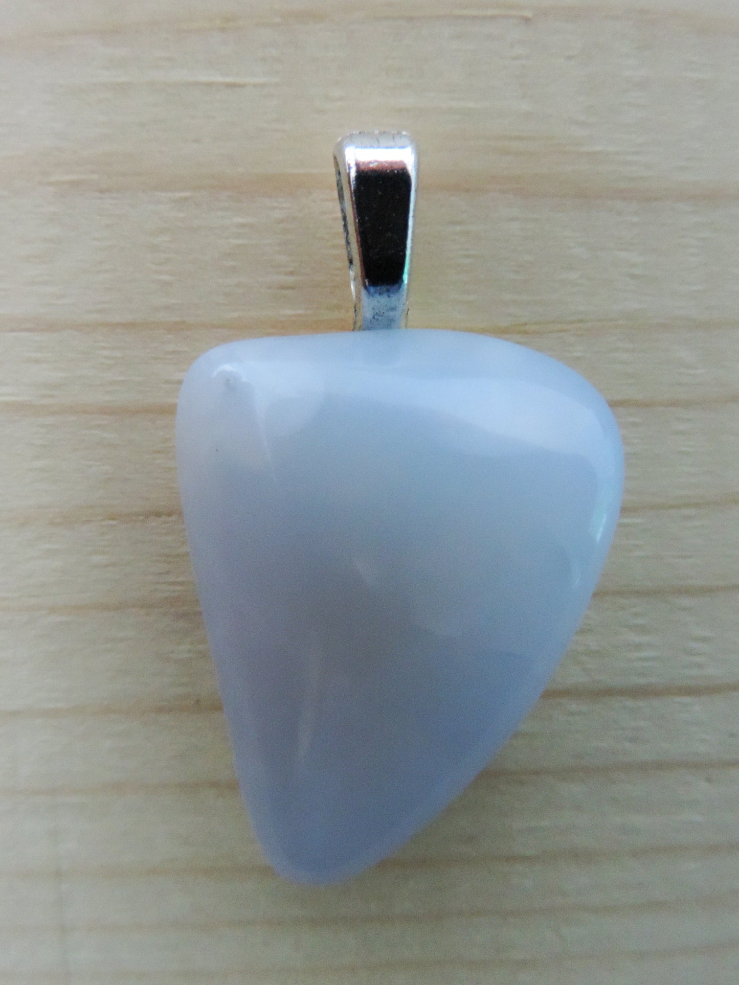 This rare stone is found in only a few locations in Montana, our material is hand collected on private property in the mountains and carried out in backpacks...each piece worth its weight in every step!  The translucent blue agate and its color variations have an alluring effect, many people find the blue agate a relaxing, calming and peaceful stone to wear.  Original and unique in design, each piece is hand crafted by lapidary artists in Montana.