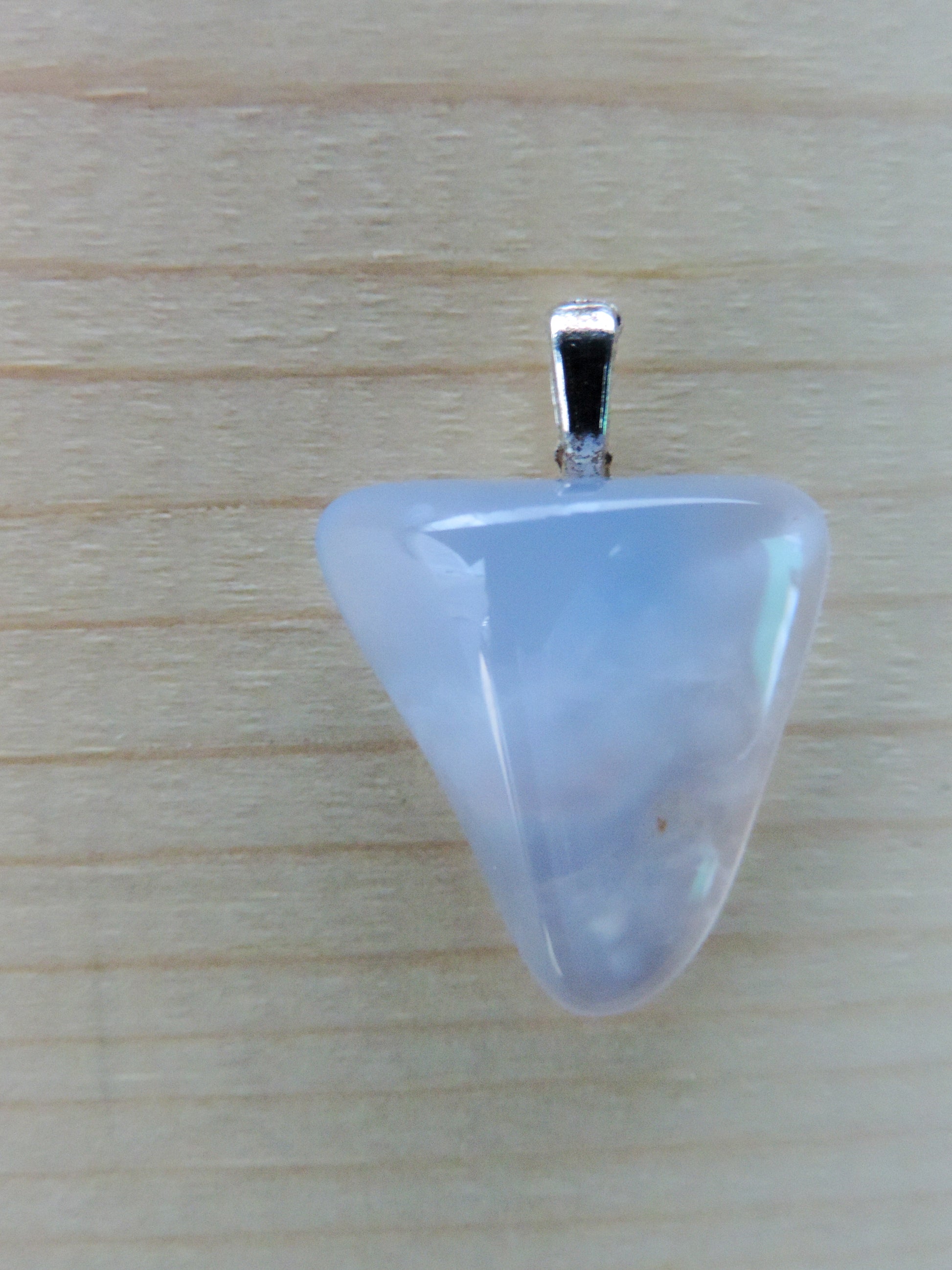 This rare stone is found in only a few locations in Montana, our material is hand collected on private property in the mountains and carried out in backpacks...each piece worth its weight in every step!  The translucent blue agate and its color variations have an alluring effect, many people find the blue agate a relaxing, calming and peaceful stone to wear.  Original and unique in design, each piece is hand crafted by lapidary artists in Montana.