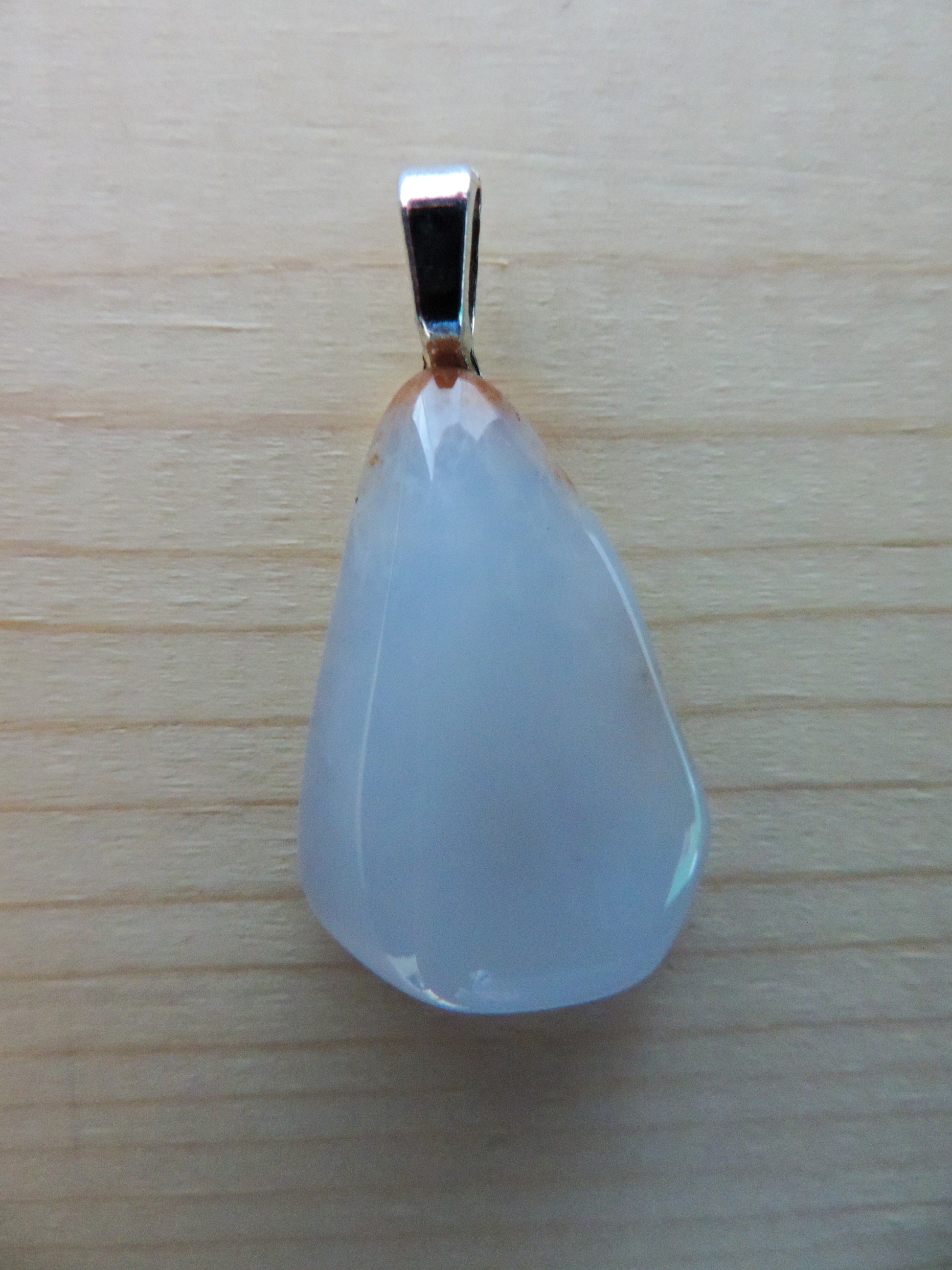 This rare stone is found in only a few locations in Montana, our material is hand collected on private property in the mountains and carried out in backpacks...each piece worth its weight in every step!  The translucent blue agate and its color variations have an alluring effect, many people find the blue agate a relaxing, calming and peaceful stone to wear.  Original and unique in design, each piece is hand crafted by lapidary artists in Montana.