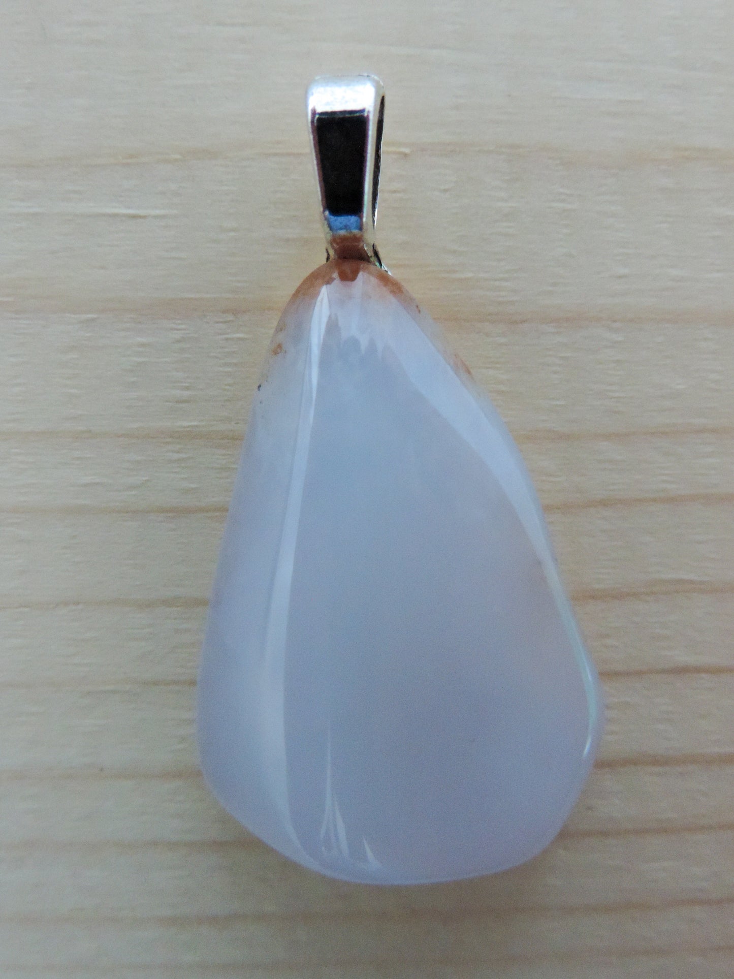 This rare stone is found in only a few locations in Montana, our material is hand collected on private property in the mountains and carried out in backpacks...each piece worth its weight in every step! The translucent blue agate and its color variations have an alluring effect, many people find the blue agate a relaxing, calming and peaceful stone to wear. Original and unique in design, each piece is hand crafted by lapidary artists in Montana.