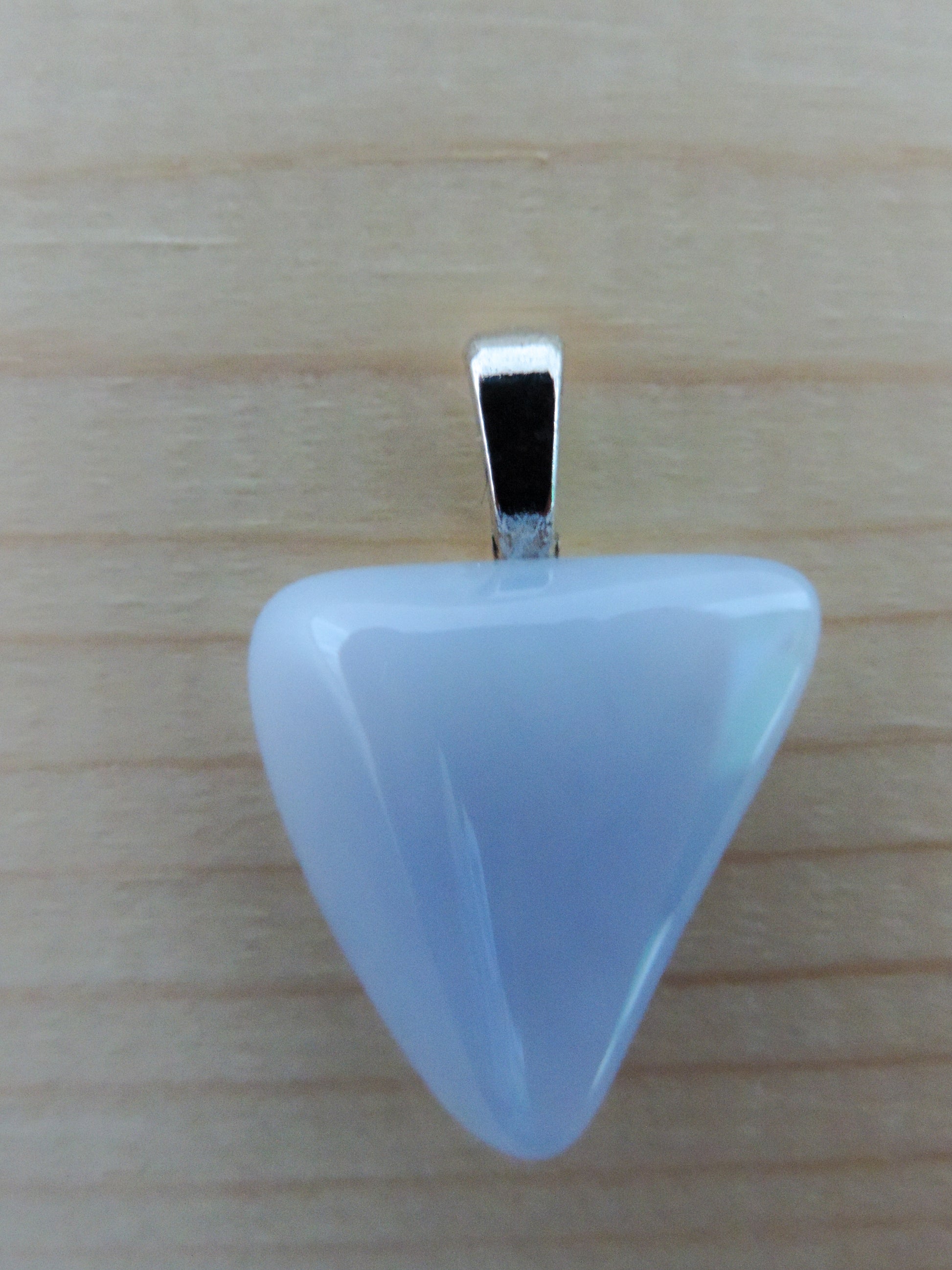 This rare stone is found in only a few locations in Montana, our material is hand collected on private property in the mountains and carried out in backpacks...each piece worth its weight in every step!  The translucent blue agate and its color variations have an alluring effect, many people find the blue agate a relaxing, calming and peaceful stone to wear.  Original and unique in design, each piece is hand crafted by lapidary artists in Montana.