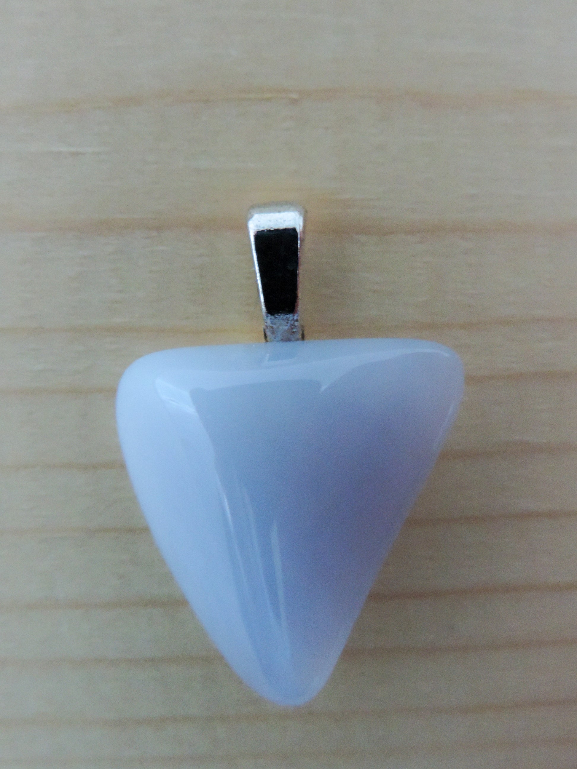 This rare stone is found in only a few locations in Montana, our material is hand collected on private property in the mountains and carried out in backpacks...each piece worth its weight in every step!  The translucent blue agate and its color variations have an alluring effect, many people find the blue agate a relaxing, calming and peaceful stone to wear.  Original and unique in design, each piece is hand crafted by lapidary artists in Montana.