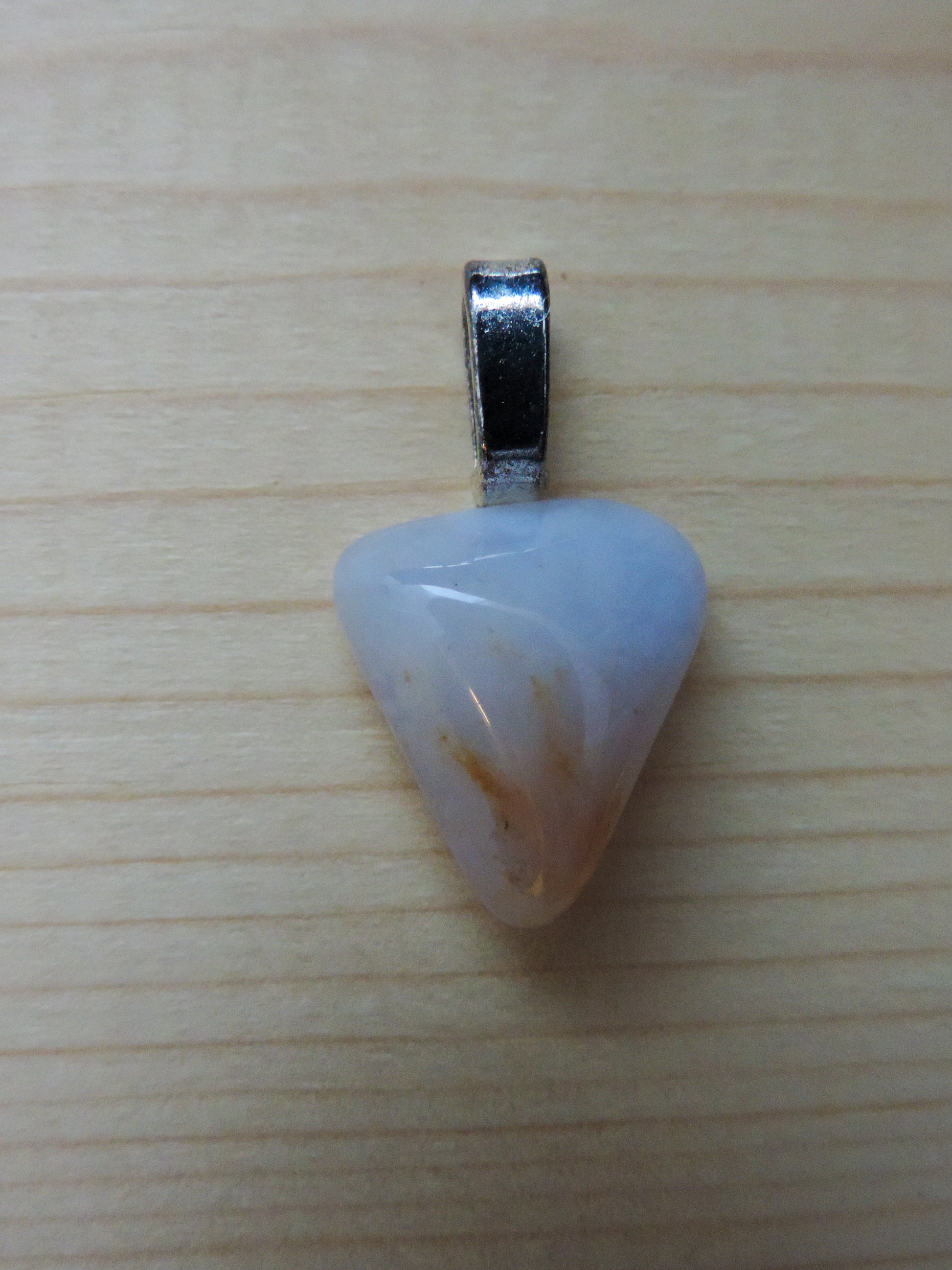 This rare stone is found in only a few locations in Montana, our material is hand collected on private property in the mountains and carried out in backpacks...each piece worth its weight in every step!  The translucent blue agate and its color variations have an alluring effect, many people find the blue agate a relaxing, calming and peaceful stone to wear.  Original and unique in design, each piece is hand crafted by lapidary artists in Montana.