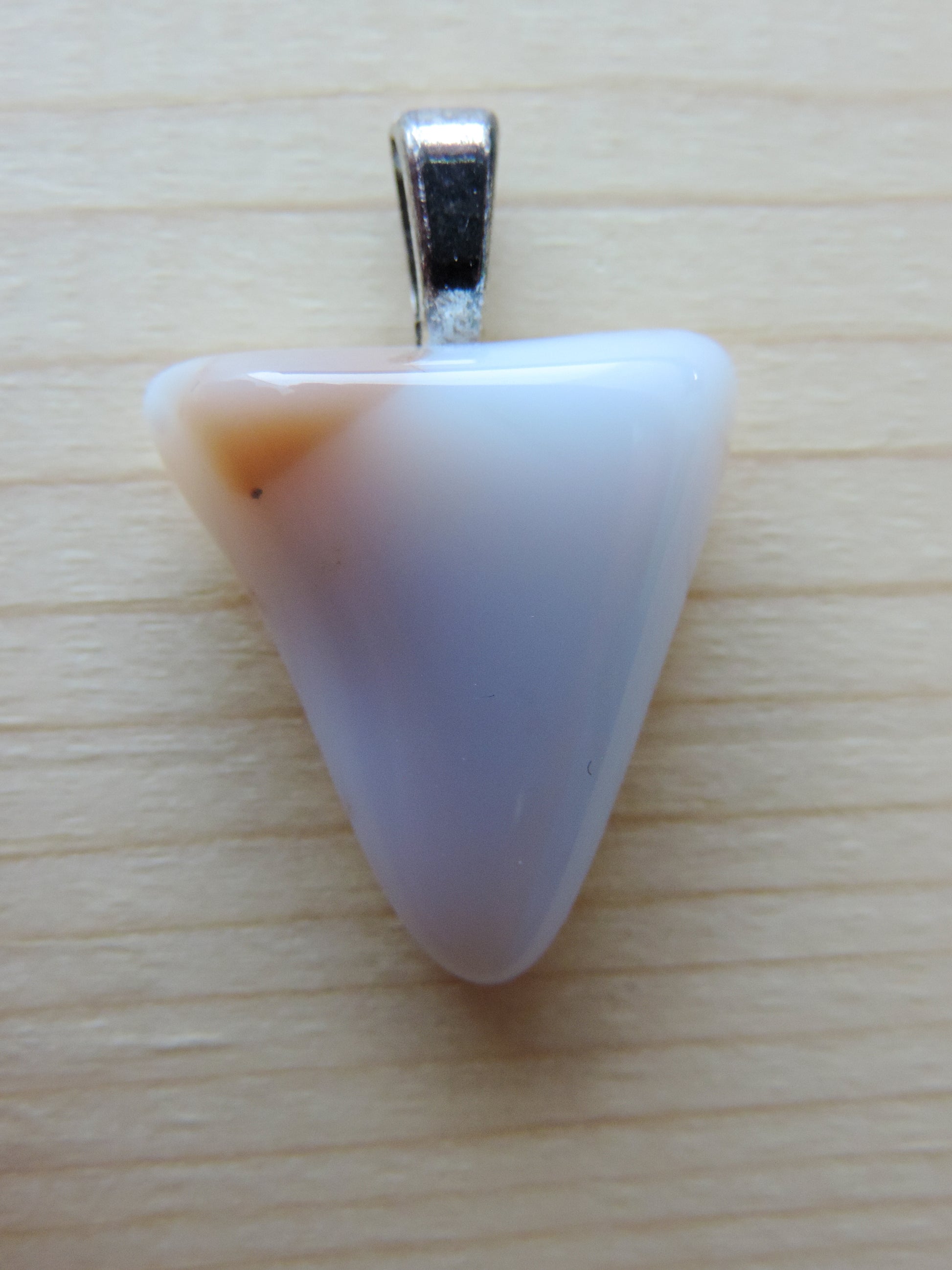 This rare stone is found in only a few locations in Montana, our material is hand collected on private property in the mountains and carried out in backpacks...each piece worth its weight in every step!  The translucent blue agate and its color variations have an alluring effect, many people find the blue agate a relaxing, calming and peaceful stone to wear.  Original and unique in design, each piece is hand crafted by lapidary artists in Montana.