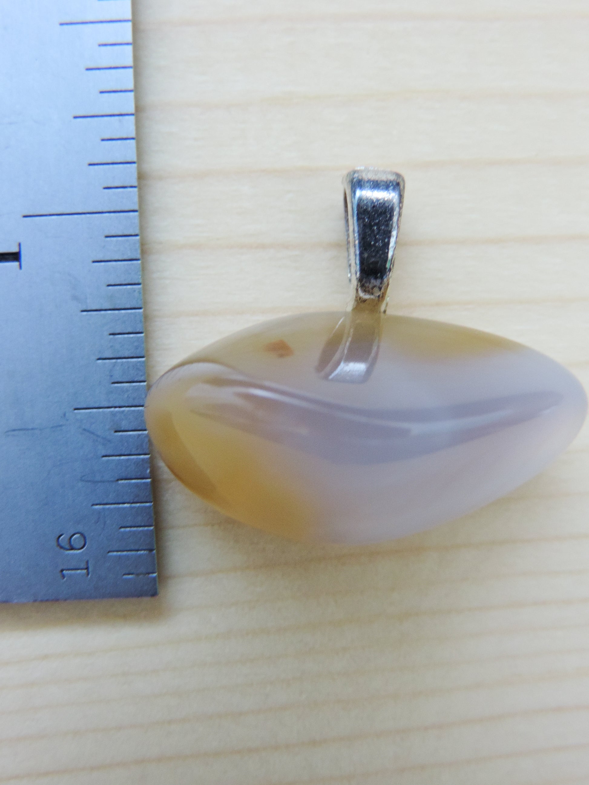 This rare stone is found in only a few locations in Montana, our material is hand collected on private property in the mountains and carried out in backpacks...each piece worth its weight in every step!  The translucent blue agate and its color variations have an alluring effect, many people find the blue agate a relaxing, calming and peaceful stone to wear.  Original and unique in design, each piece is hand crafted by lapidary artists in Montana.