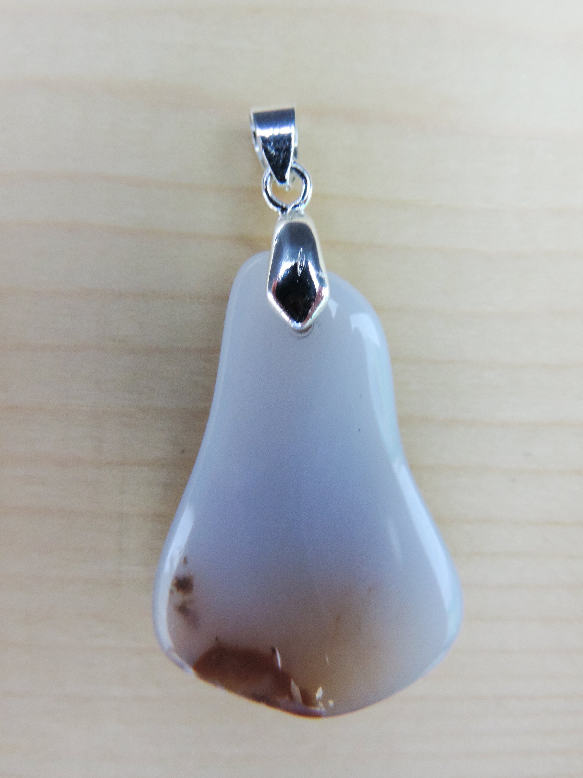 This rare stone is found in only a few locations in Montana, our material is hand collected on private property in the mountains and carried out in backpacks...each piece worth its weight in every step!  The translucent blue agate and its color variations have an alluring effect, many people find the blue agate a relaxing, calming and peaceful stone to wear.  Original and unique in design, each piece is hand crafted by lapidary artists in Montana.