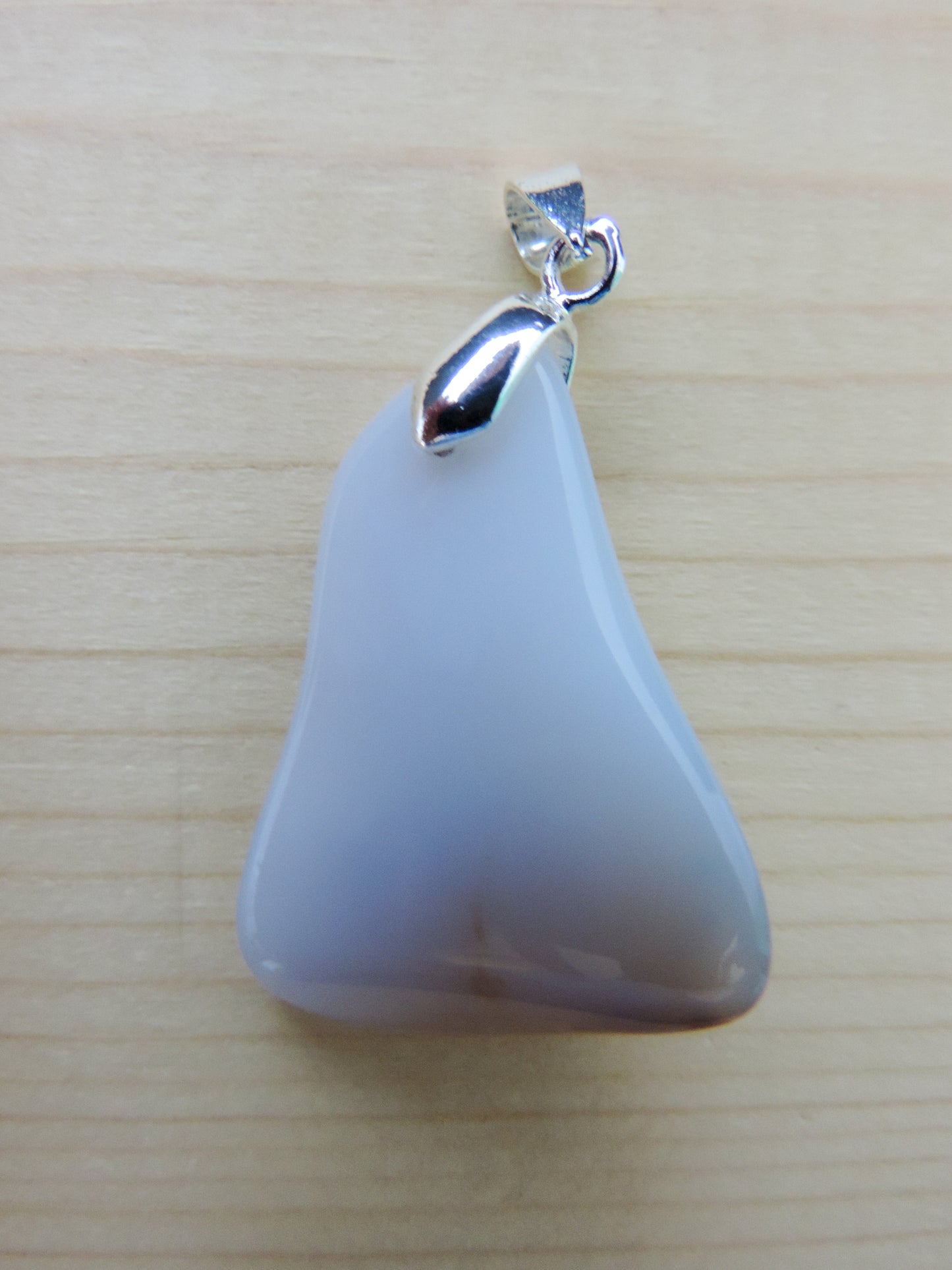 This rare stone is found in only a few locations in Montana, our material is hand collected on private property in the mountains and carried out in backpacks...each piece worth its weight in every step!  The translucent blue agate and its color variations have an alluring effect, many people find the blue agate a relaxing, calming and peaceful stone to wear.  Original and unique in design, each piece is hand crafted by lapidary artists in Montana.