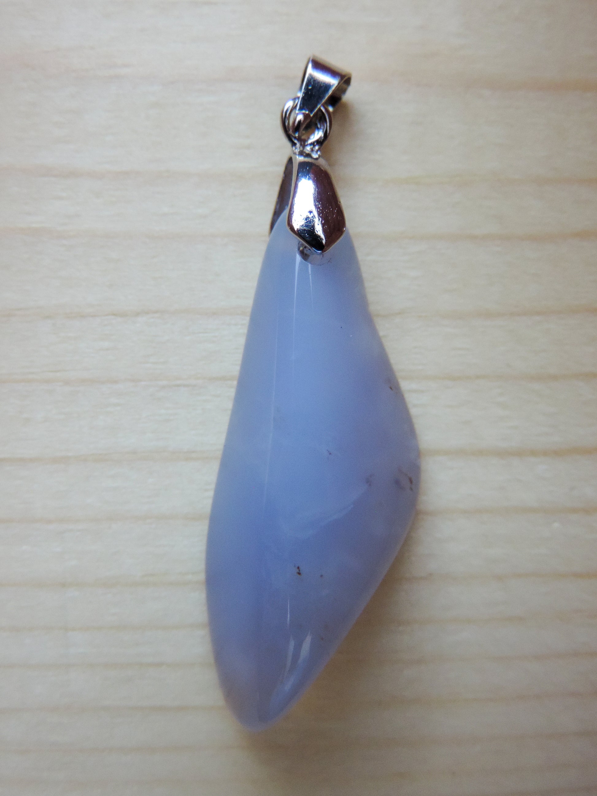 This rare stone is found in only a few locations in Montana, our material is hand collected on private property in the mountains and carried out in backpacks...each piece worth its weight in every step!  The translucent blue agate and its color variations have an alluring effect, many people find the blue agate a relaxing, calming and peaceful stone to wear.  Original and unique in design, each piece is hand crafted by lapidary artists in Montana.