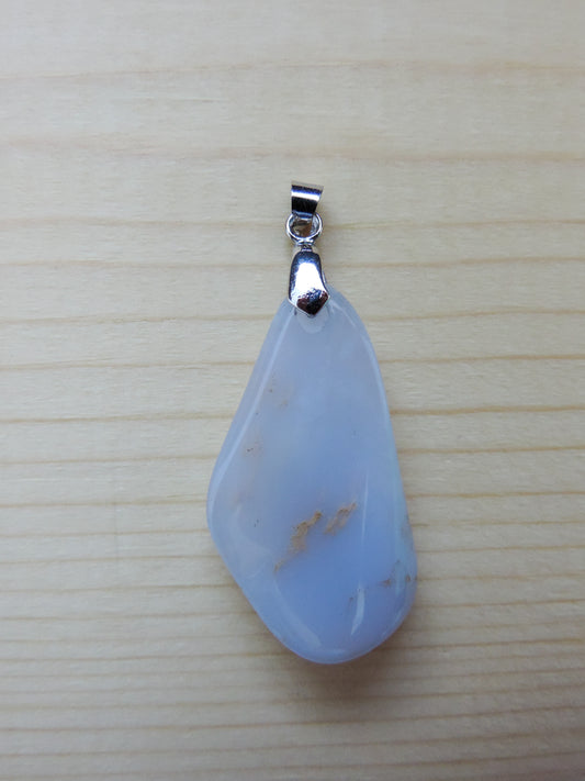 This rare stone is found in only a few locations in Montana, our material is hand collected on private property in the mountains and carried out in backpacks...each piece worth its weight in every step!  The translucent blue agate and its color variations have an alluring effect, many people find the blue agate a relaxing, calming and peaceful stone to wear.  Original and unique in design, each piece is hand crafted by lapidary artists in Montana.