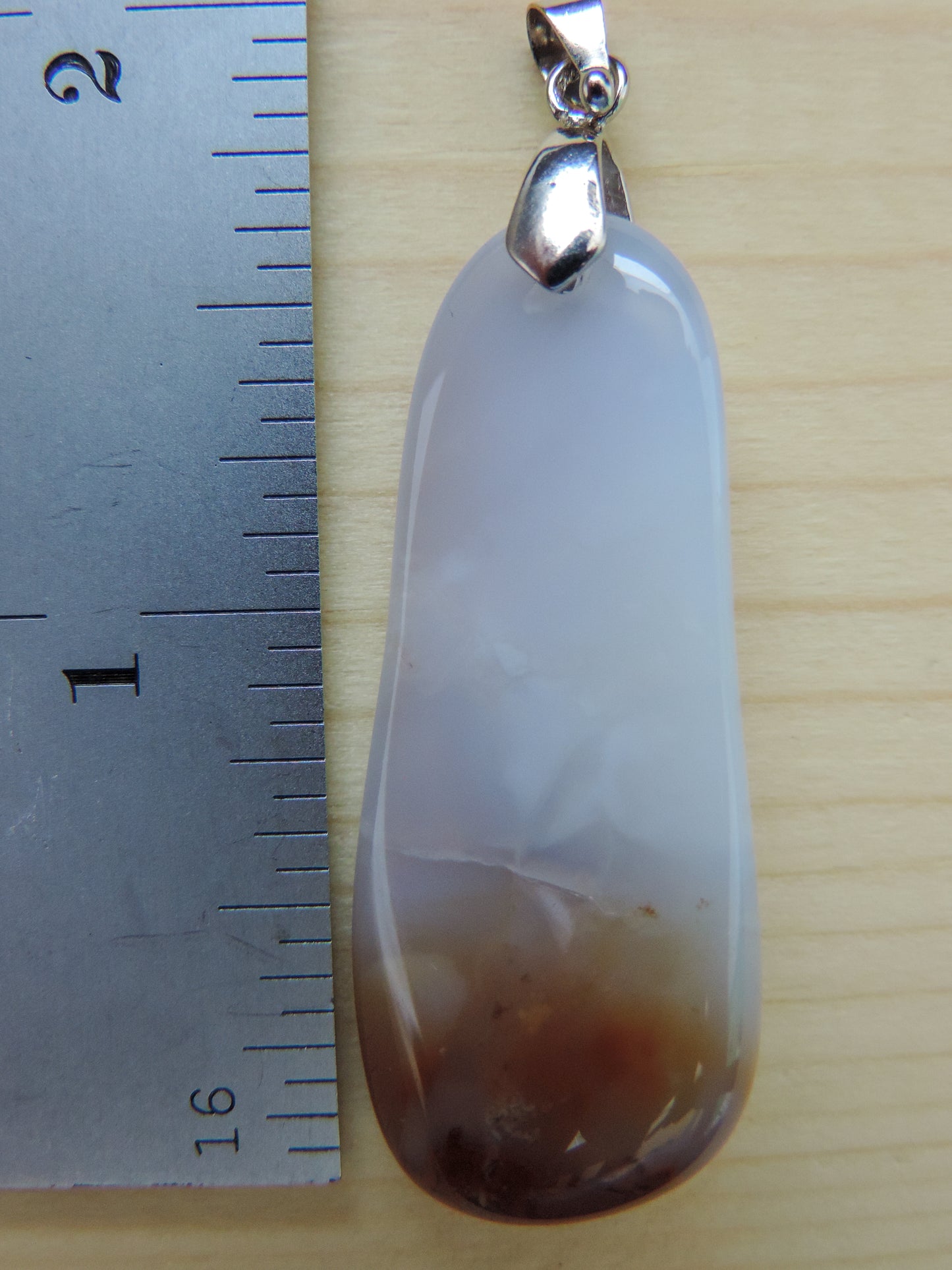 Known as the Treasure State, Montana’s landscape is an abundant resource for precious and semi-precious stones. One of the semi-precious stones, Madison Blue Agate, is featured in this pendant. This rare stone is found in only a few locations in Montana, our material is hand collected on private property in the mountains and carried out in backpacks...each piece worth its weight in every step!
