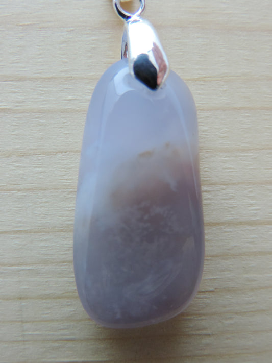 This rare stone is found in only a few locations in Montana, our material is hand collected on private property in the mountains and carried out in backpacks...each piece worth its weight in every step!  The translucent blue agate and its color variations have an alluring effect, many people find the blue agate a relaxing, calming and peaceful stone to wear.  Original and unique in design, each piece is hand crafted by lapidary artists in Montana.