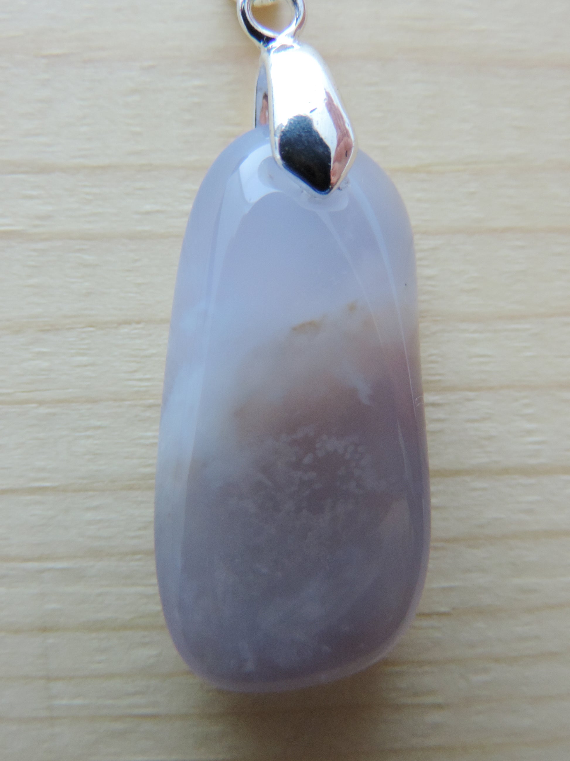 This rare stone is found in only a few locations in Montana, our material is hand collected on private property in the mountains and carried out in backpacks...each piece worth its weight in every step!  The translucent blue agate and its color variations have an alluring effect, many people find the blue agate a relaxing, calming and peaceful stone to wear.  Original and unique in design, each piece is hand crafted by lapidary artists in Montana.