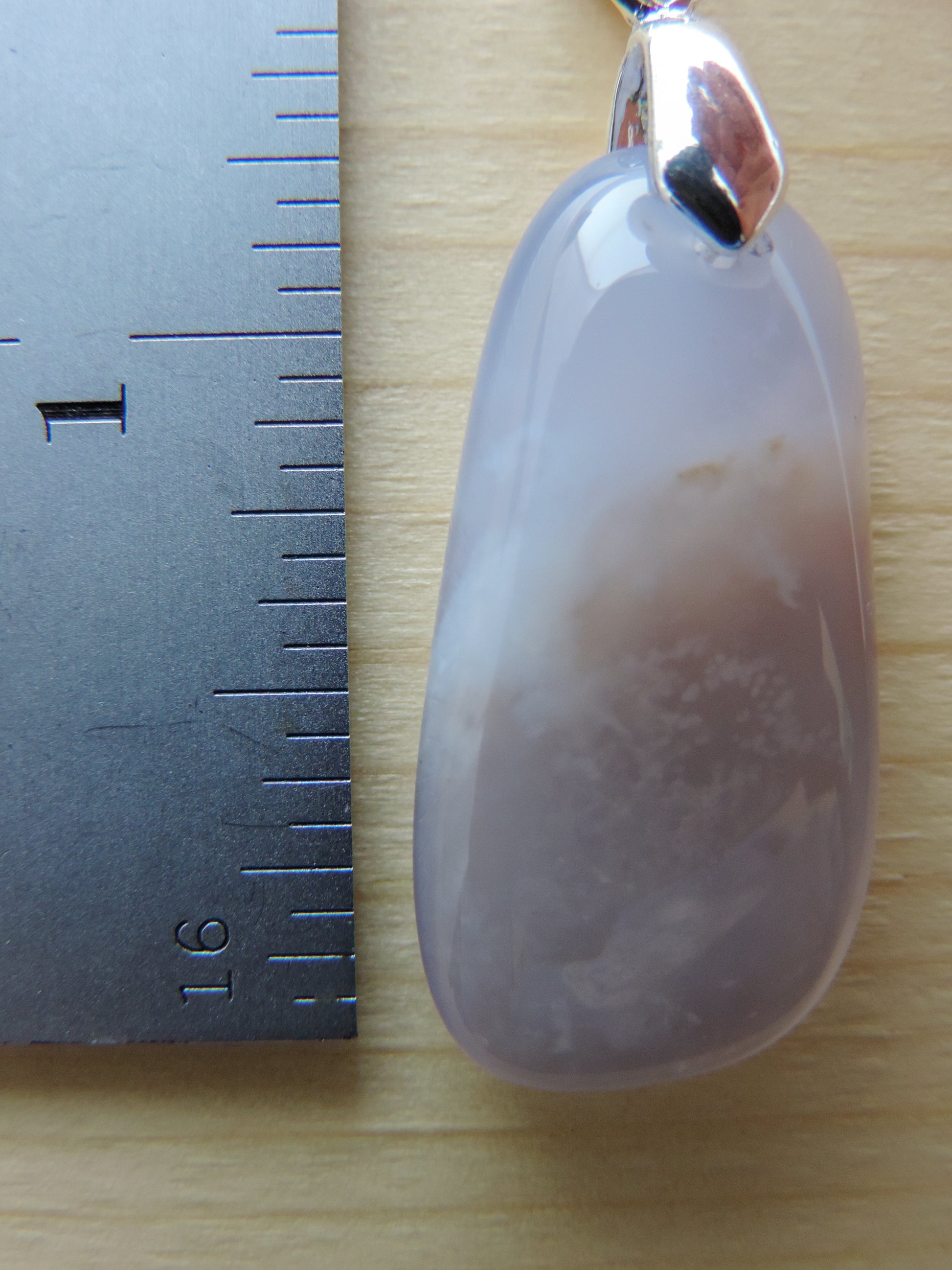 This rare stone is found in only a few locations in Montana, our material is hand collected on private property in the mountains and carried out in backpacks...each piece worth its weight in every step!  The translucent blue agate and its color variations have an alluring effect, many people find the blue agate a relaxing, calming and peaceful stone to wear.  Original and unique in design, each piece is hand crafted by lapidary artists in Montana.