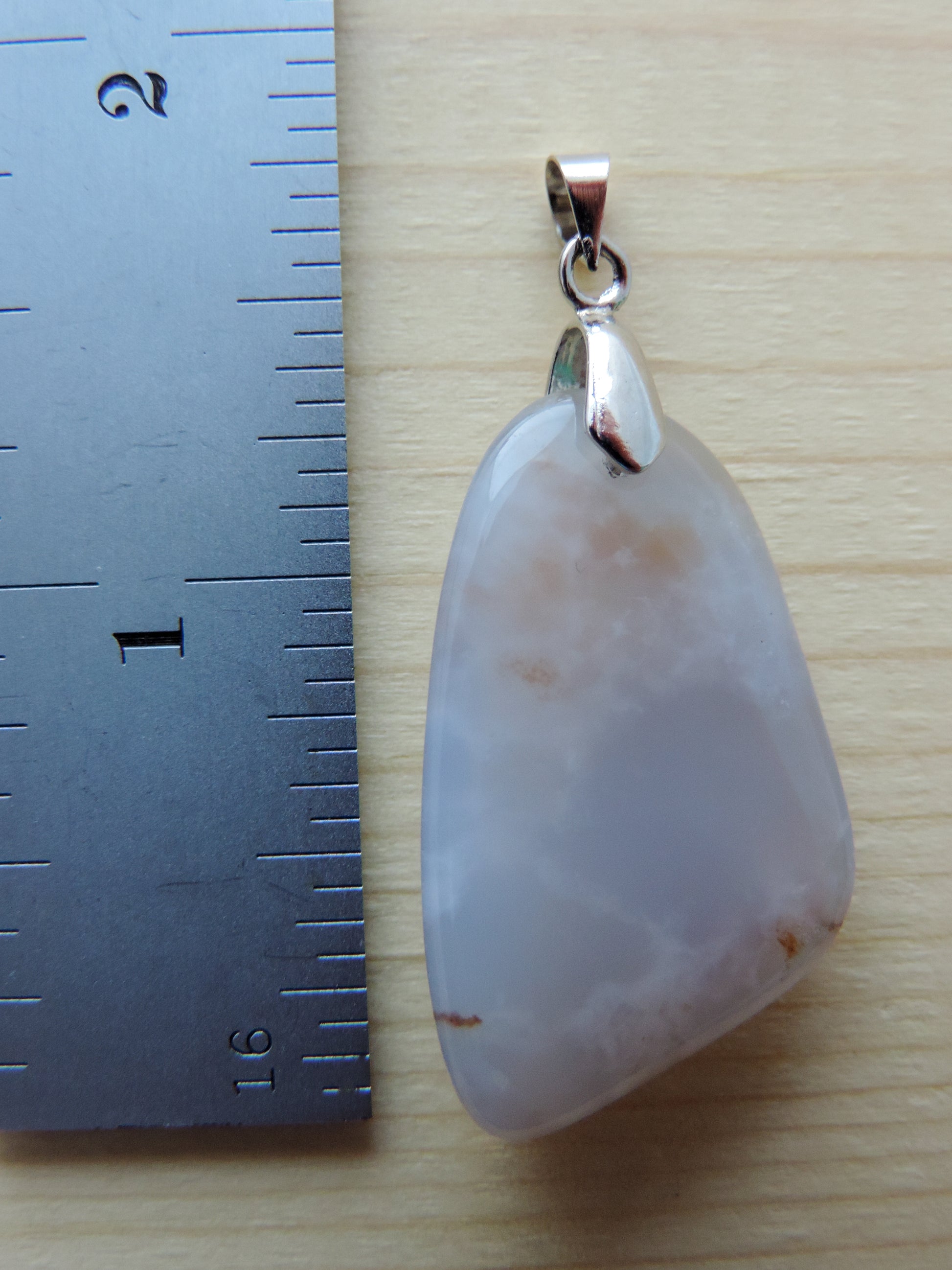 This rare stone is found in only a few locations in Montana, our material is hand collected on private property in the mountains and carried out in backpacks...each piece worth its weight in every step!  The translucent blue agate and its color variations have an alluring effect, many people find the blue agate a relaxing, calming and peaceful stone to wear.  Original and unique in design, each piece is hand crafted by lapidary artists in Montana.