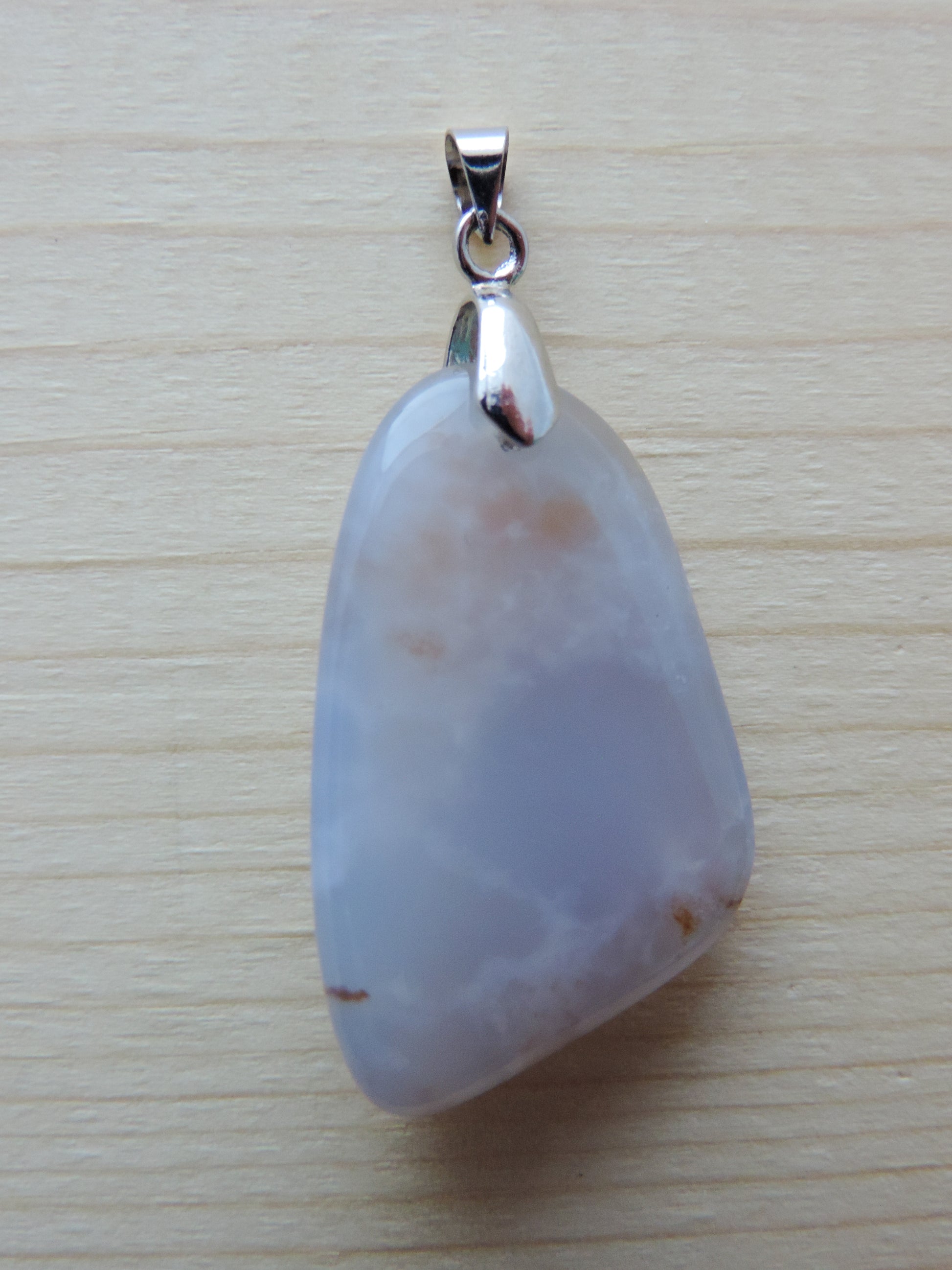 This rare stone is found in only a few locations in Montana, our material is hand collected on private property in the mountains and carried out in backpacks...each piece worth its weight in every step!  The translucent blue agate and its color variations have an alluring effect, many people find the blue agate a relaxing, calming and peaceful stone to wear.  Original and unique in design, each piece is hand crafted by lapidary artists in Montana.