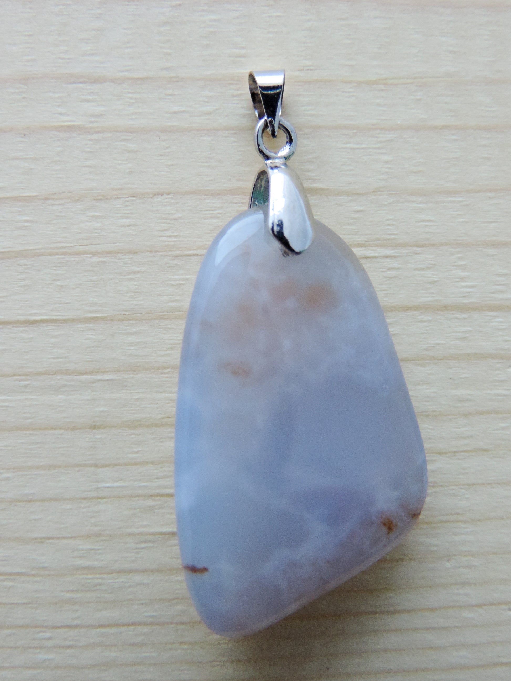 This rare stone is found in only a few locations in Montana, our material is hand collected on private property in the mountains and carried out in backpacks...each piece worth its weight in every step!  The translucent blue agate and its color variations have an alluring effect, many people find the blue agate a relaxing, calming and peaceful stone to wear.  Original and unique in design, each piece is hand crafted by lapidary artists in Montana.