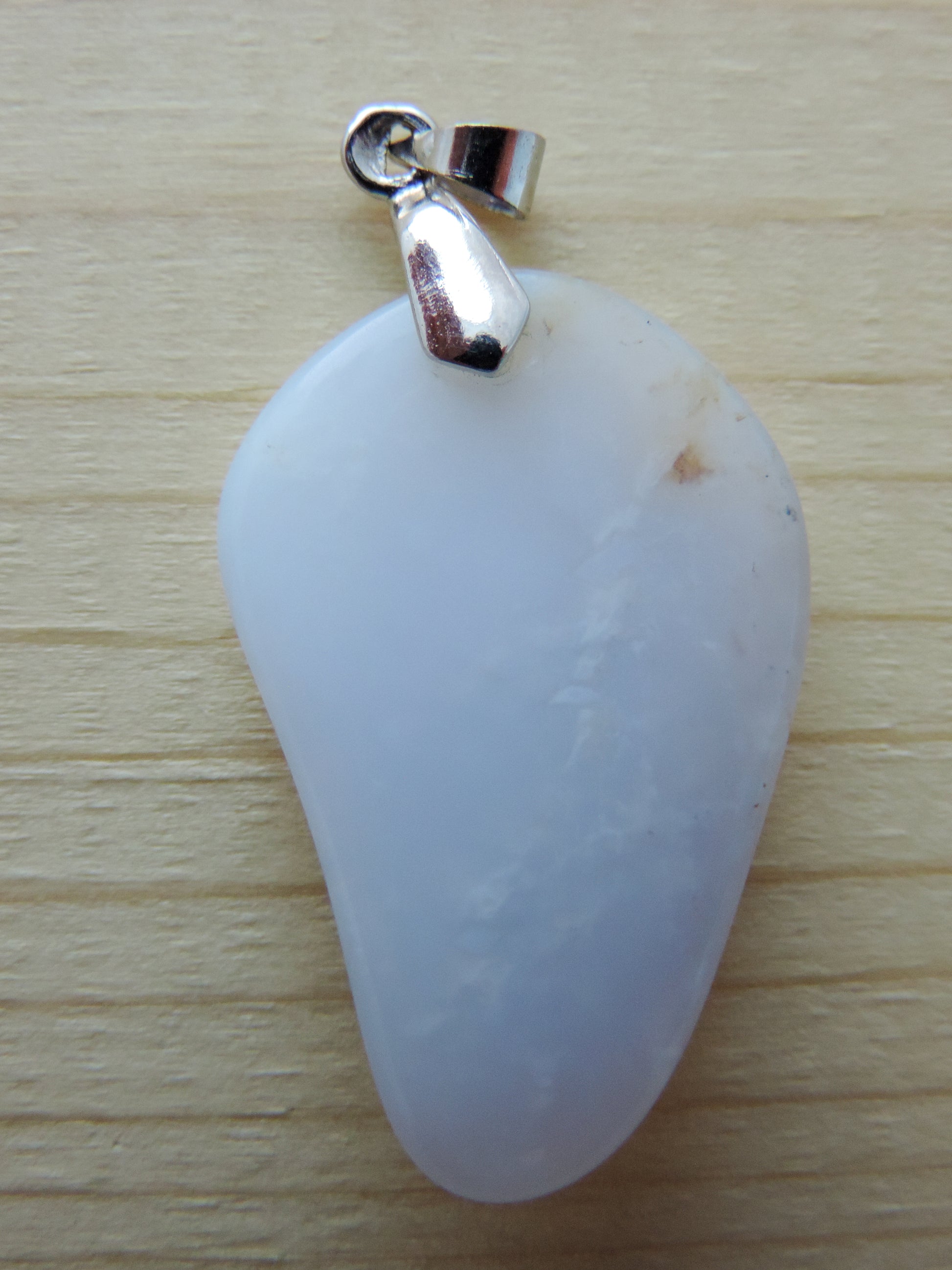 This rare stone is found in only a few locations in Montana, our material is hand collected on private property in the mountains and carried out in backpacks...each piece worth its weight in every step!  The translucent blue agate and its color variations have an alluring effect, many people find the blue agate a relaxing, calming and peaceful stone to wear.  Original and unique in design, each piece is hand crafted by lapidary artists in Montana.