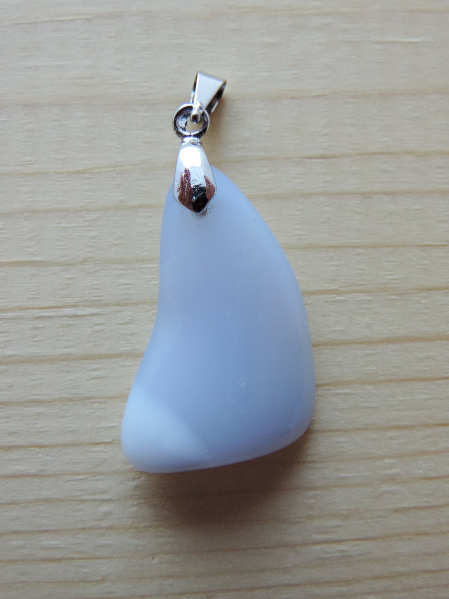 Montana Madison Blue Agate Pendant. The stone in this pendant is a unique result of tumble shaping and polishing a piece of agate from its natural state.