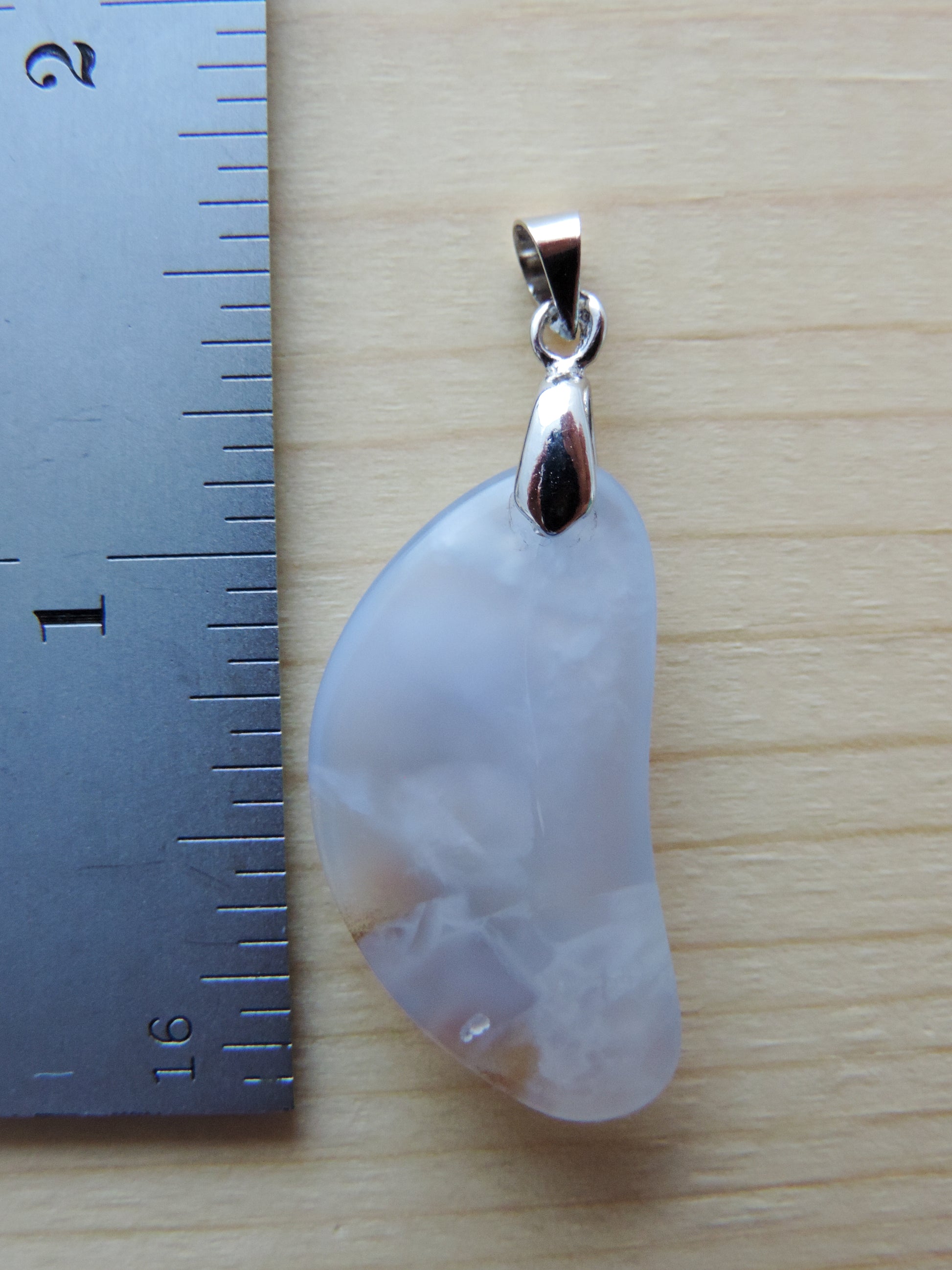 This rare stone is found in only a few locations in Montana, our material is hand collected on private property in the mountains and carried out in backpacks...each piece worth its weight in every step!  The translucent blue agate and its color variations have an alluring effect, many people find the blue agate a relaxing, calming and peaceful stone to wear.  Original and unique in design, each piece is hand crafted by lapidary artists in Montana.