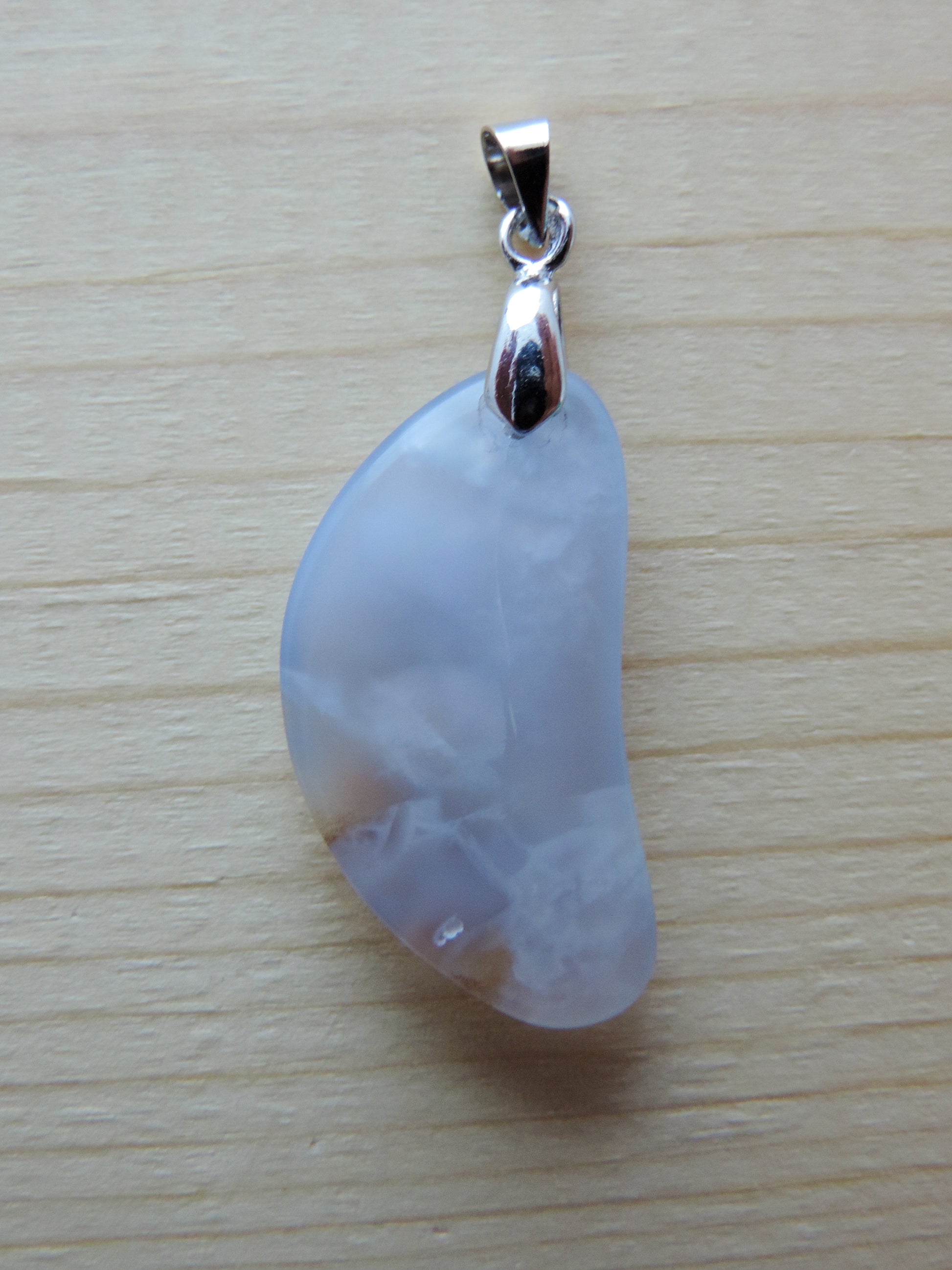 This rare stone is found in only a few locations in Montana, our material is hand collected on private property in the mountains and carried out in backpacks...each piece worth its weight in every step!  The translucent blue agate and its color variations have an alluring effect, many people find the blue agate a relaxing, calming and peaceful stone to wear.  Original and unique in design, each piece is hand crafted by lapidary artists in Montana.