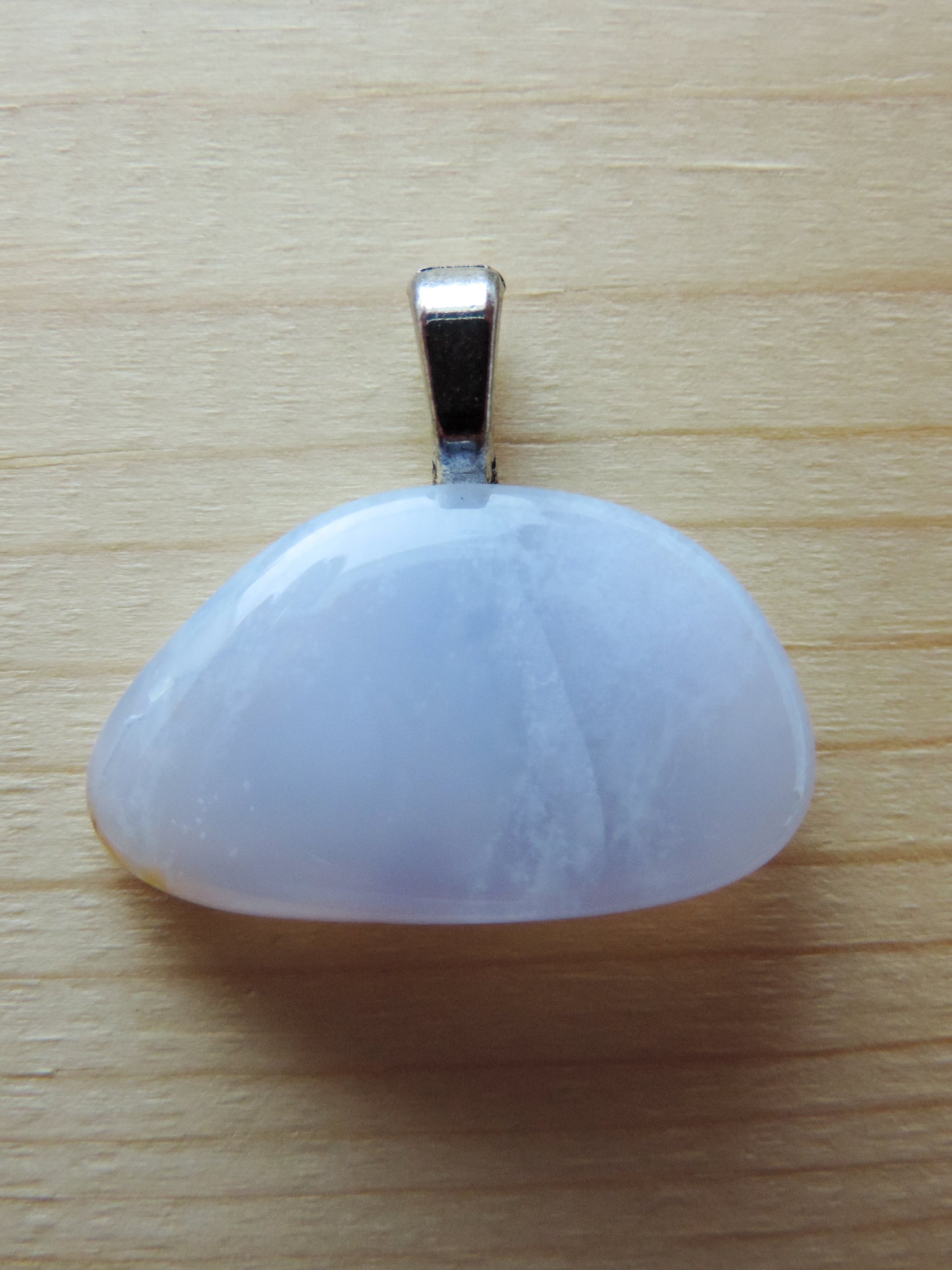 This rare stone is found in only a few locations in Montana, our material is hand collected on private property in the mountains and carried out in backpacks...each piece worth its weight in every step!  The translucent blue agate and its color variations have an alluring effect, many people find the blue agate a relaxing, calming and peaceful stone to wear.  Original and unique in design, each piece is hand crafted by lapidary artists in Montana.