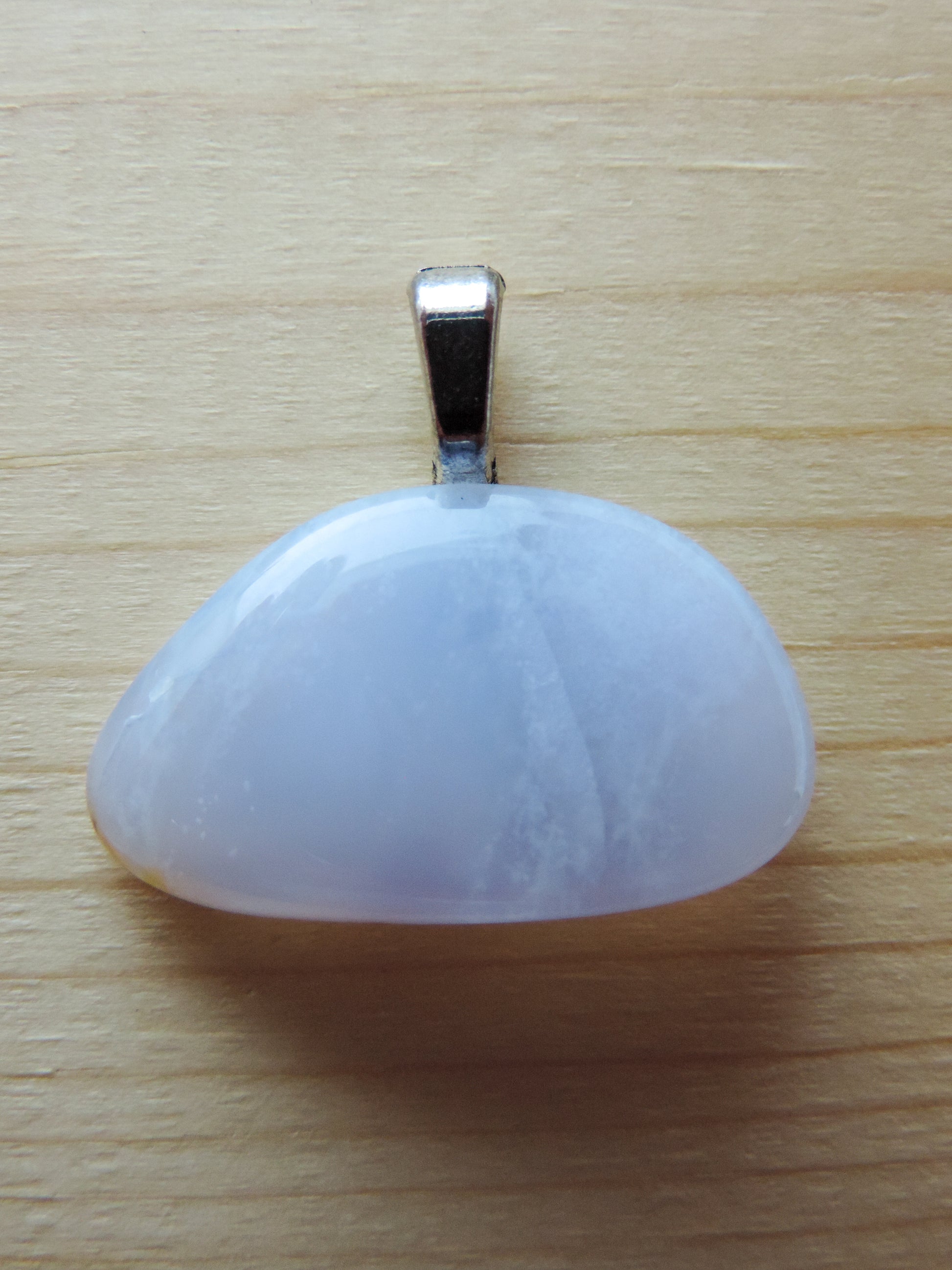 This rare stone is found in only a few locations in Montana, our material is hand collected on private property in the mountains and carried out in backpacks...each piece worth its weight in every step!  The translucent blue agate and its color variations have an alluring effect, many people find the blue agate a relaxing, calming and peaceful stone to wear.  Original and unique in design, each piece is hand crafted by lapidary artists in Montana.