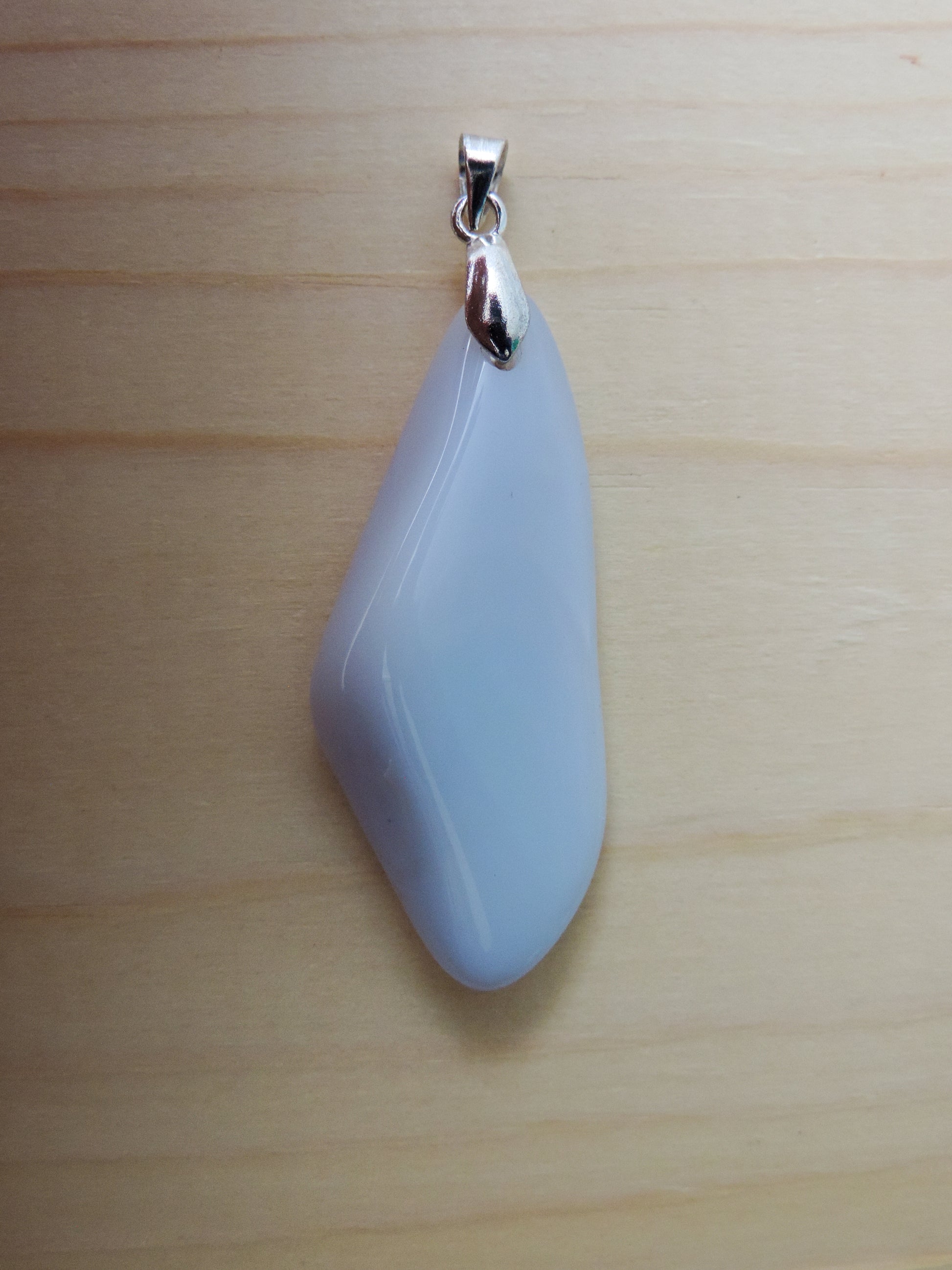 One of the semi-precious stones, Madison Blue Agate, is featured in this pendant.  This rare stone is found in only a few locations in Montana, our material is hand collected on private property in the mountains and carried out in backpacks..