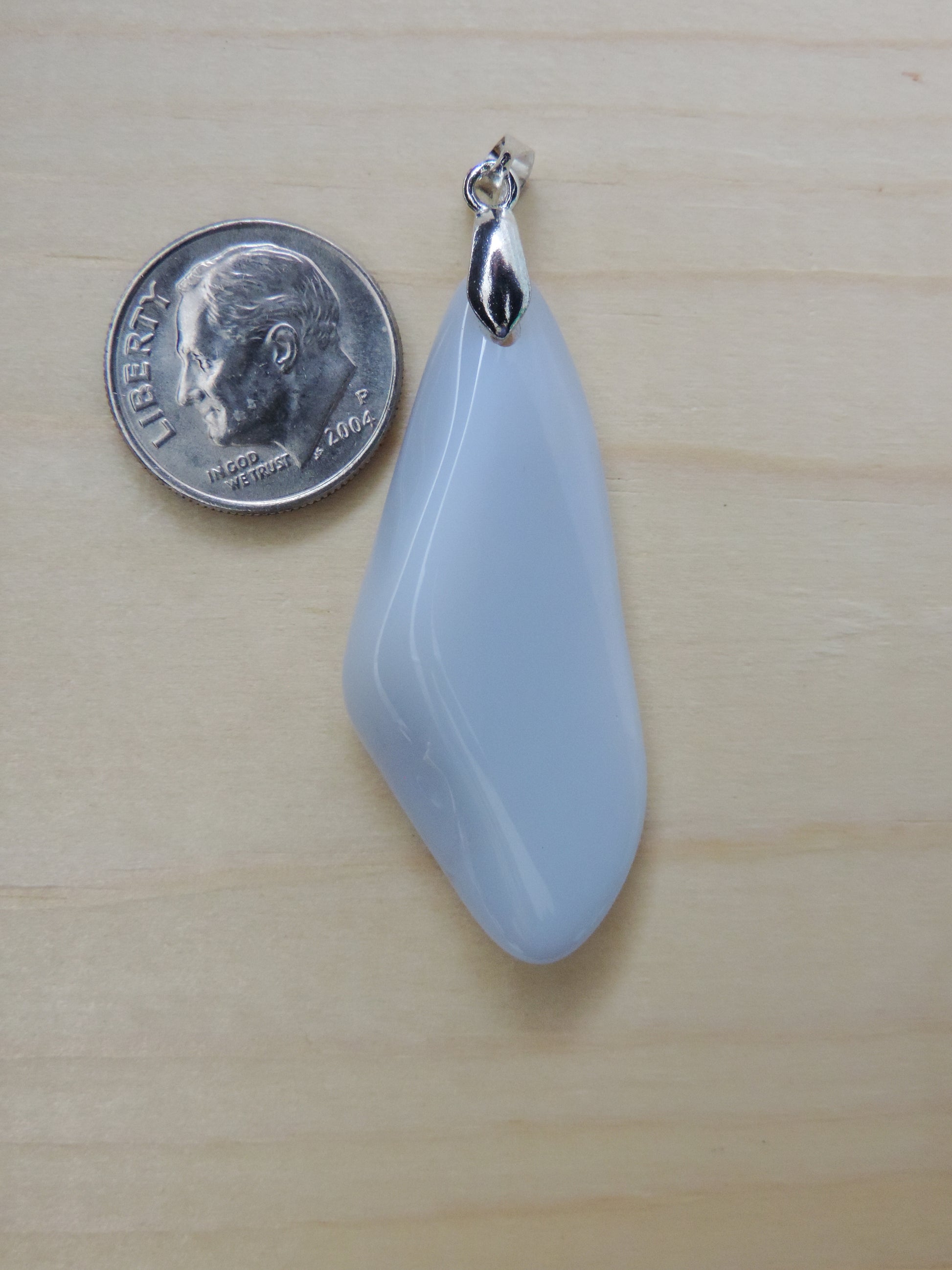 One of the semi-precious stones, Madison Blue Agate, is featured in this pendant.  This rare stone is found in only a few locations in Montana, our material is hand collected on private property in the mountains and carried out in backpacks..