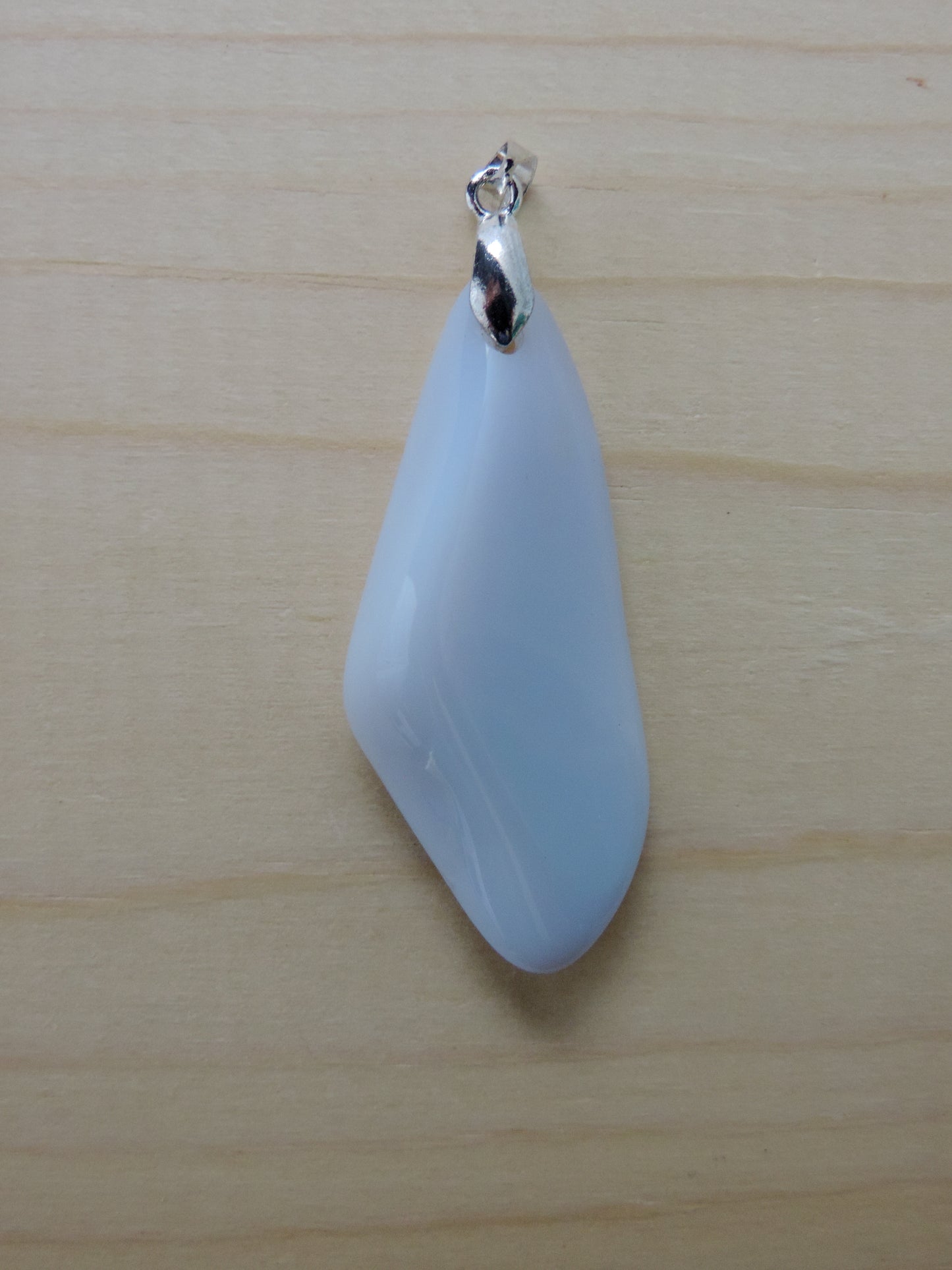 One of the semi-precious stones, Madison Blue Agate, is featured in this pendant.  This rare stone is found in only a few locations in Montana, our material is hand collected on private property in the mountains and carried out in backpacks..