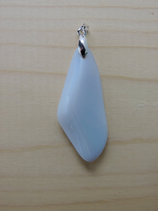 One of the semi-precious stones, Madison Blue Agate, is featured in this pendant.  This rare stone is found in only a few locations in Montana, our material is hand collected on private property in the mountains and carried out in backpacks..