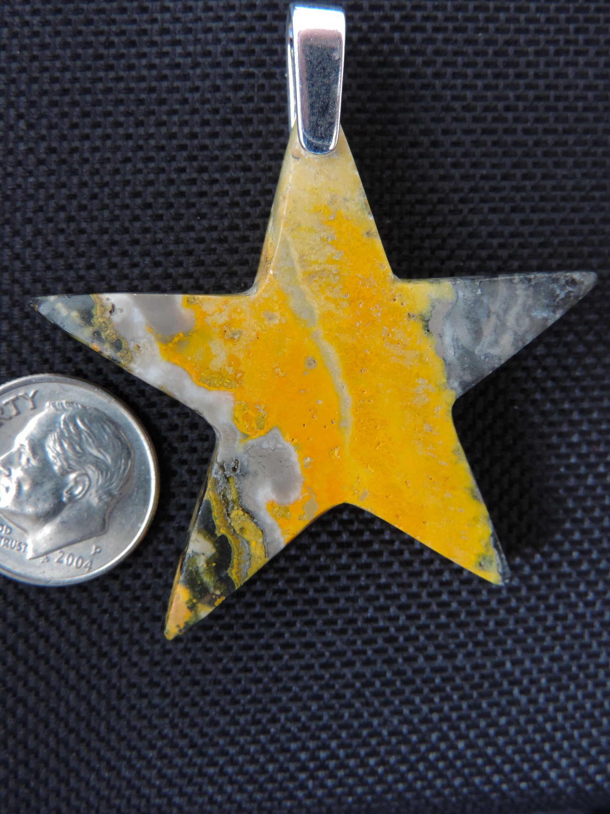 Our hand crafted jewelry pendant is photographed next to a ruler for size.  This stone is a natural color, no dyes or heat treatment have been used.  