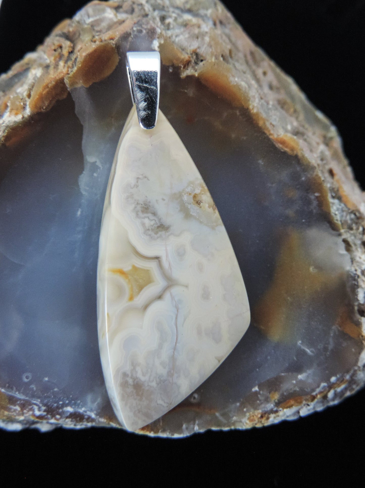 Find your perfect Indonesian Agate pendant on our store!  The pendant bail is authentic 925 sterling silver.   Our hand crafted jewelry pendant is photographed next to a ruler for size