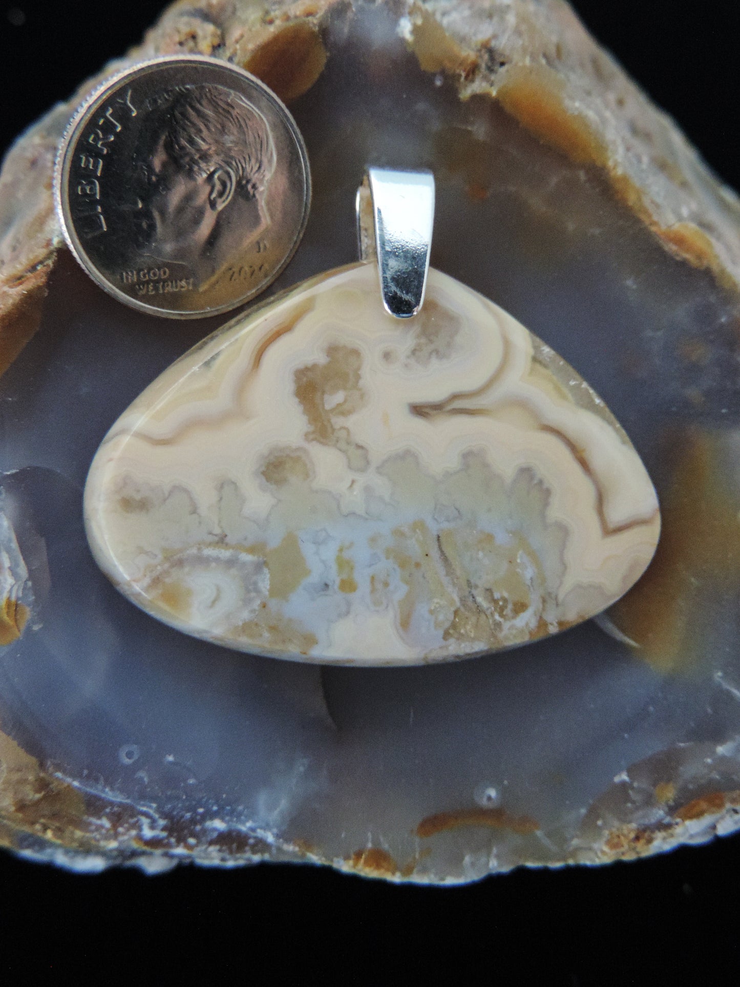 Brown Lace Agate pendant from West Sumatra.  Indonesian Agates exhibit a wide variety of colors and amazing complexity.  No two agates pendants are exactly alike, each one being a unique and beautiful creation!  