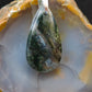 Green Moss Agate & Sterling Silver Pendant.  Green Moss Agate from West Java.  Indonesian Agates exhibit a wide variety of colors and amazing complexity.  No two agates are exactly alike, each one being a unique and beautiful creation!  Agates with multiple bands of color are known as fortification agates, those with dendritic or moss looking inclusions are referred to as moss agate and many others are given descriptive names relative to their appearance or where they are found