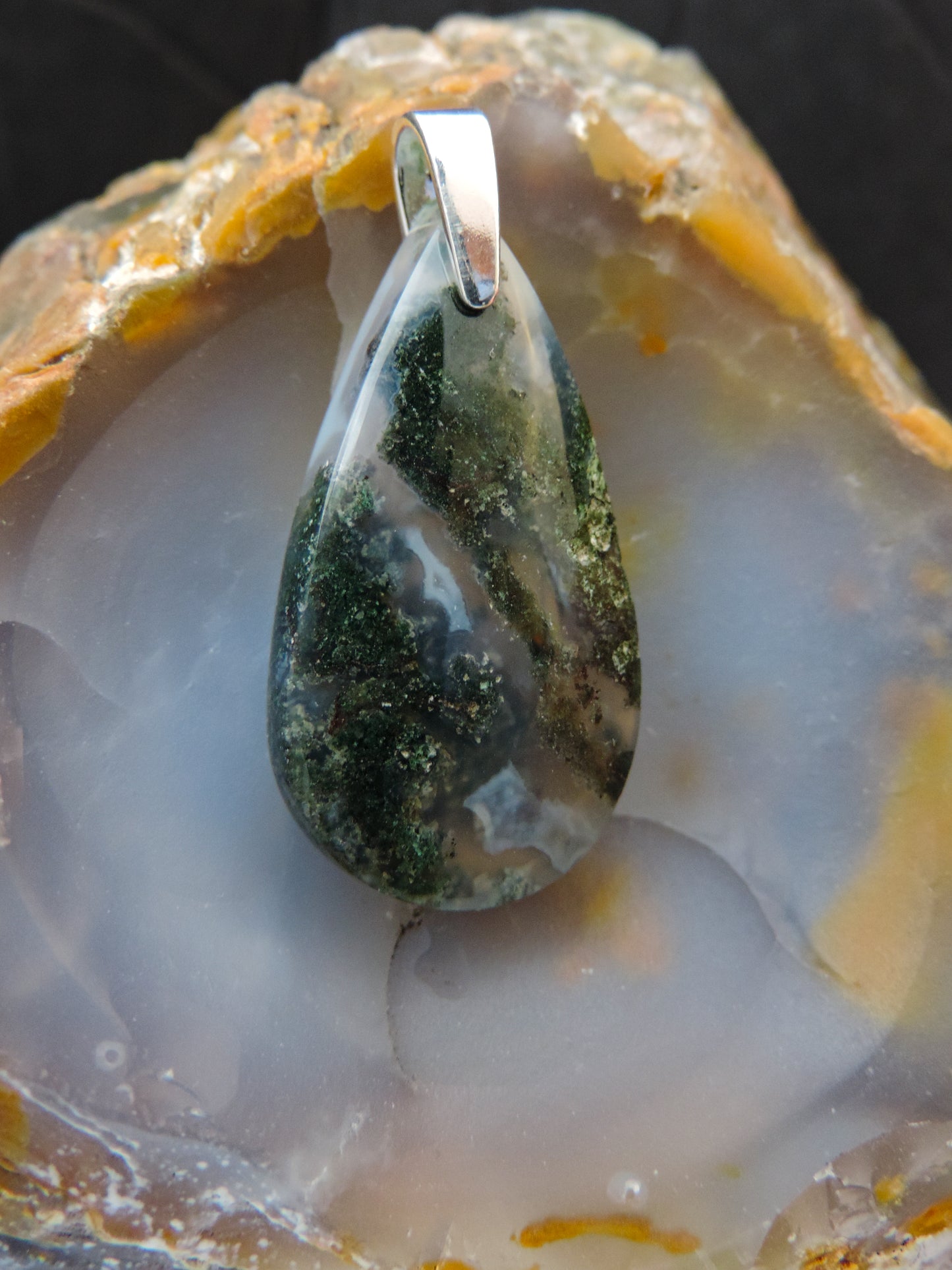 Green Moss Agate & Sterling Silver Pendant.  Green Moss Agate from West Java.  Indonesian Agates exhibit a wide variety of colors and amazing complexity.  No two agates are exactly alike, each one being a unique and beautiful creation!  Agates with multiple bands of color are known as fortification agates, those with dendritic or moss looking inclusions are referred to as moss agate and many others are given descriptive names relative to their appearance or where they are found