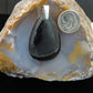 The Agni Manitite pendants on our store are unique in design.  One side is smooth and polished while the other side looks rough and irregular, a representation of its natural state.  The pendant can be worn with either side facing out.  The bail is authentic 925 sterling silver.    Often referred to as “Pearl of Divine Fire”, Agni Manitite is a rare stone found in the Indonesian 