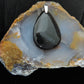 The Agni Manitite pendants on our store are unique in design.  One side is smooth and polished while the other side looks rough and irregular, a representation of its natural state.  The pendant can be worn with either side facing out.  The bail is authentic 925 sterling silver.    Often referred to as “Pearl of Divine Fire”, Agni Manitite is a rare stone found in the Indonesian 