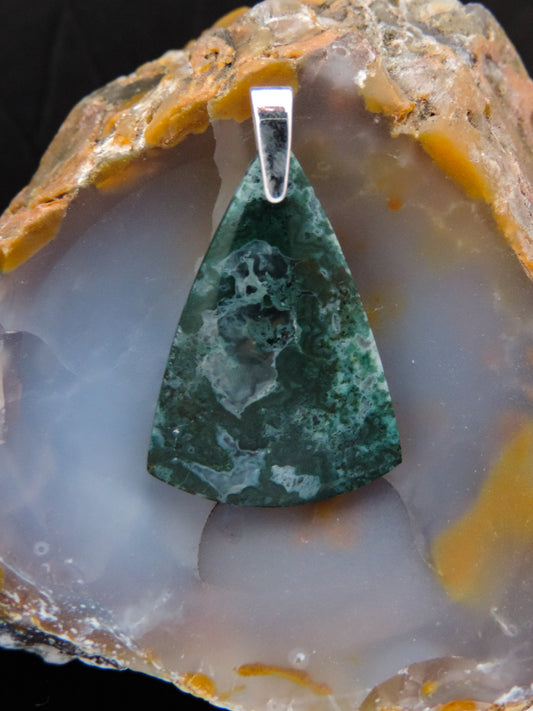 Green Moss Agate Pendant from West Java.  Indonesian Agate pendants exhibit a wide variety of colors and amazing complexity.  No two agates are exactly alike, each one being a unique and beautiful creation!  Agates with multiple bands of color are known as fortification agates