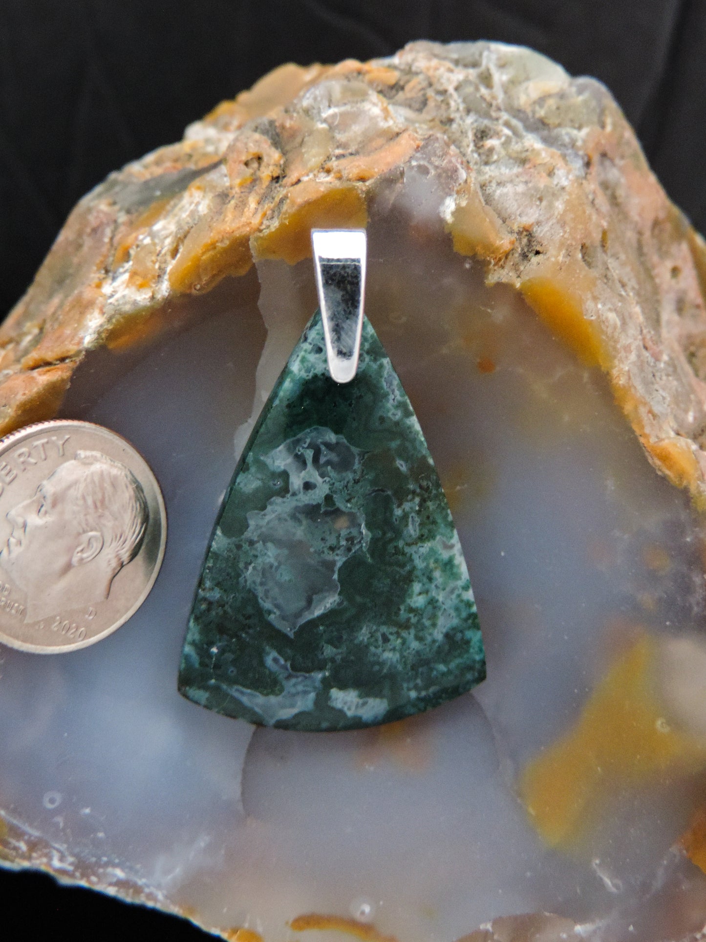 Our hand crafted jewelry pendant is photographed next to a ruler for size.  This stone is a natural color, no dyes or heat treatment have been used. 