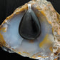 The Agni Manitite pendants on our store are unique in design.  One side is smooth and polished while the other side looks rough and irregular, a representation of its natural state.  The pendant can be worn with either side facing out.  The bail is authentic 925 sterling silver.    Often referred to as “Pearl of Divine Fire”,