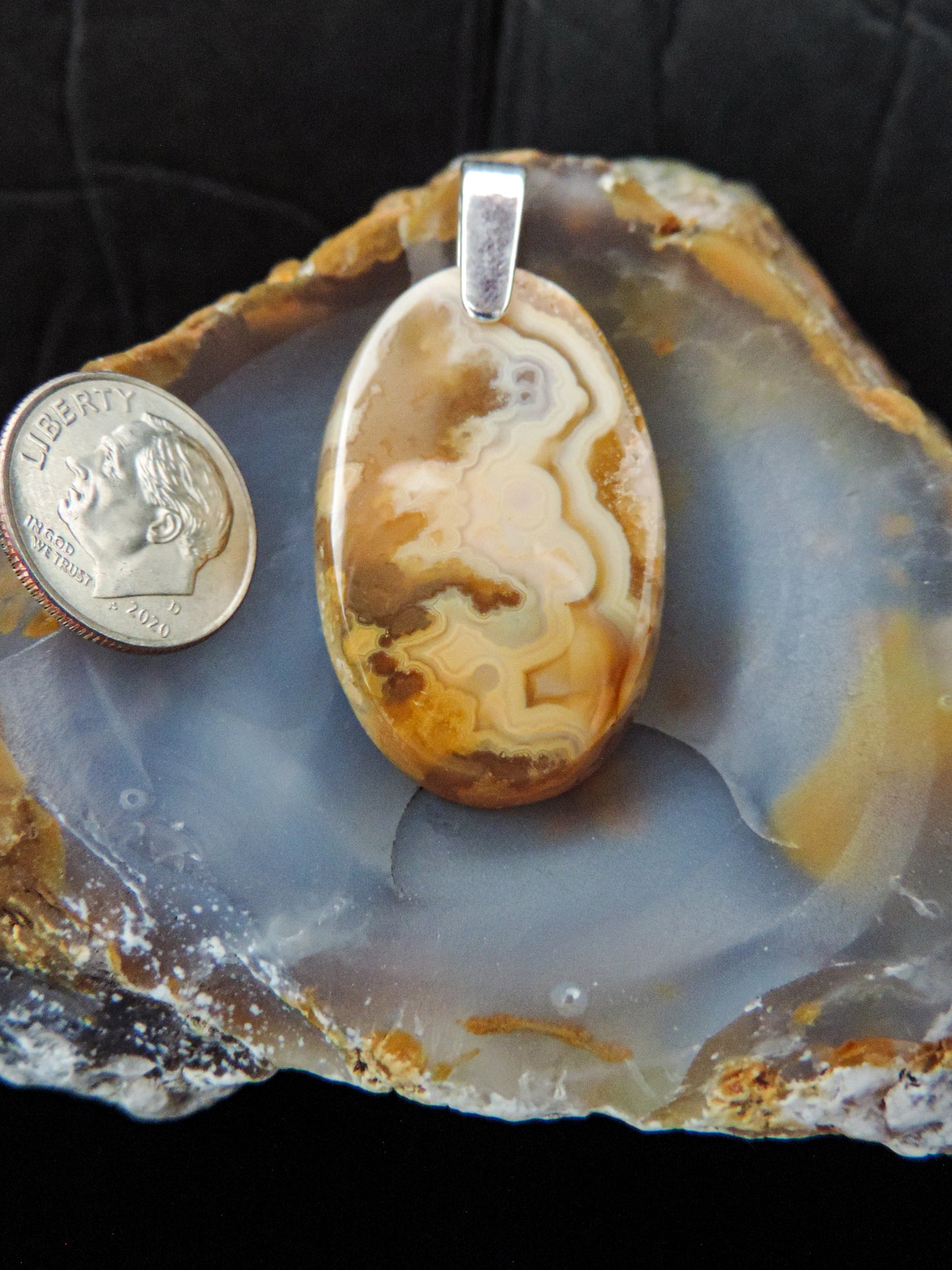 Find your perfect Indonesian Agate Pendant on our store!  The pendant bail is authentic 925 sterling silver.