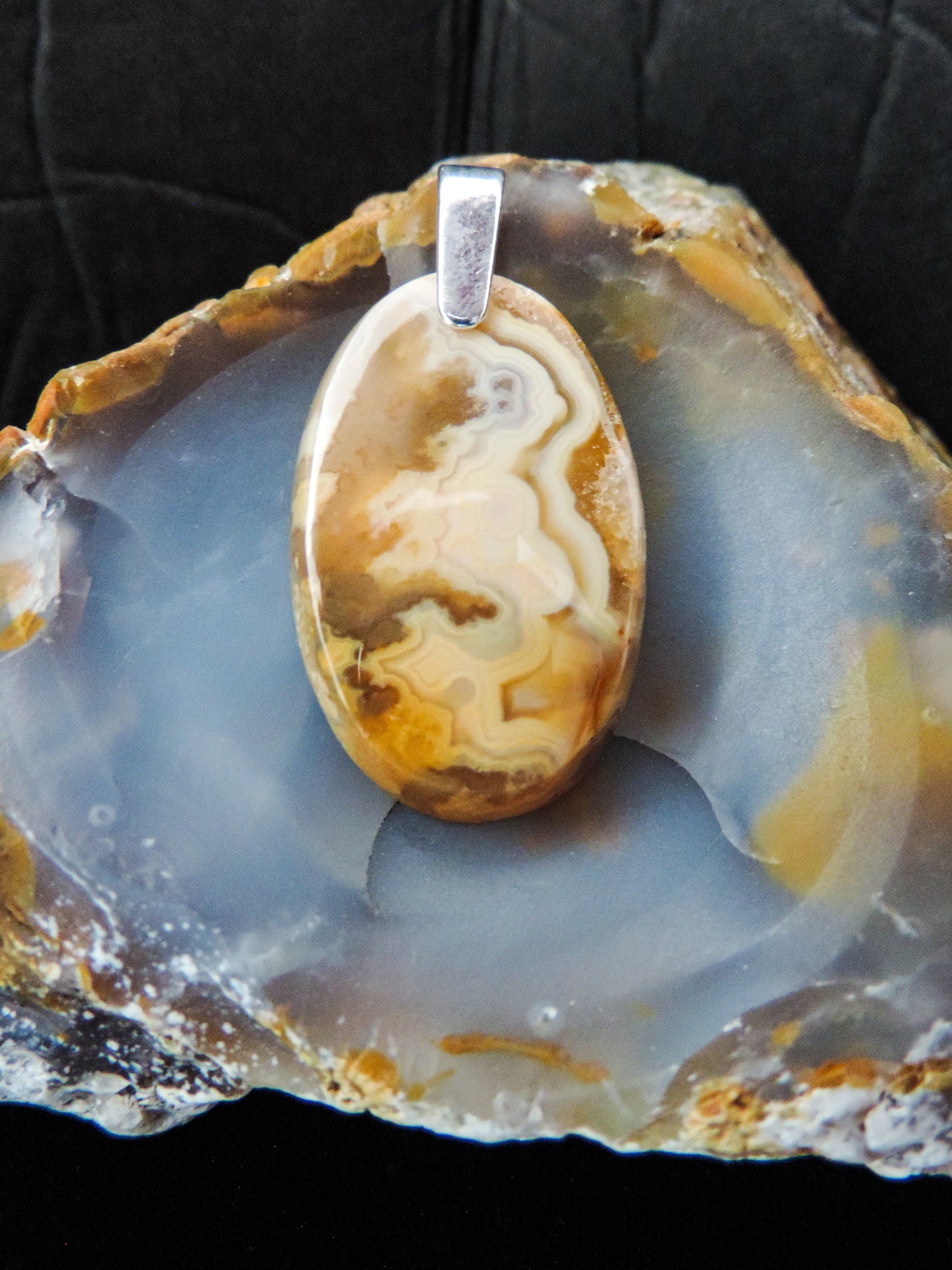 Brown Lace Agate pendant from West Sumatra.  Indonesian Agate pendants exhibit a wide variety of colors and amazing complexity.  No two agates are exactly alike